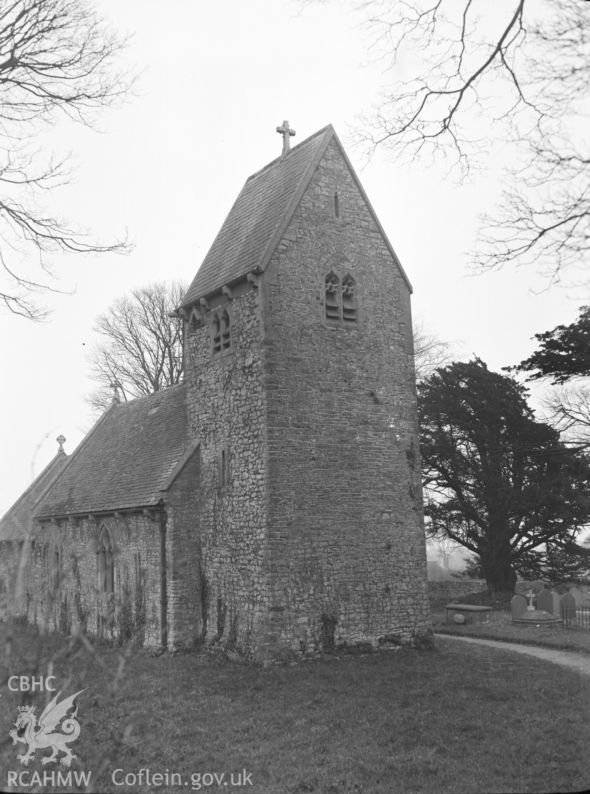 Digital copy of a nitrate negative showing exterior view of St Lythans Church near Wenvoe showing detail of 'saddleback' tower, south of chancel. From the National Building Record Postcard Collection.