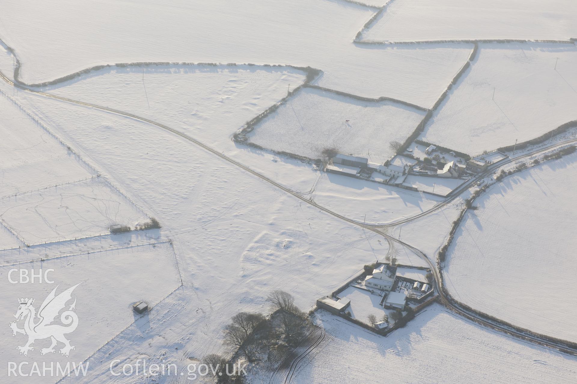 Heol-y-Mynydd round barrow, west of St. Brides, Bridgend. Oblique aerial photograph taken during the Royal Commission?s programme of archaeological aerial reconnaissance by Toby Driver on 24th January 2013.