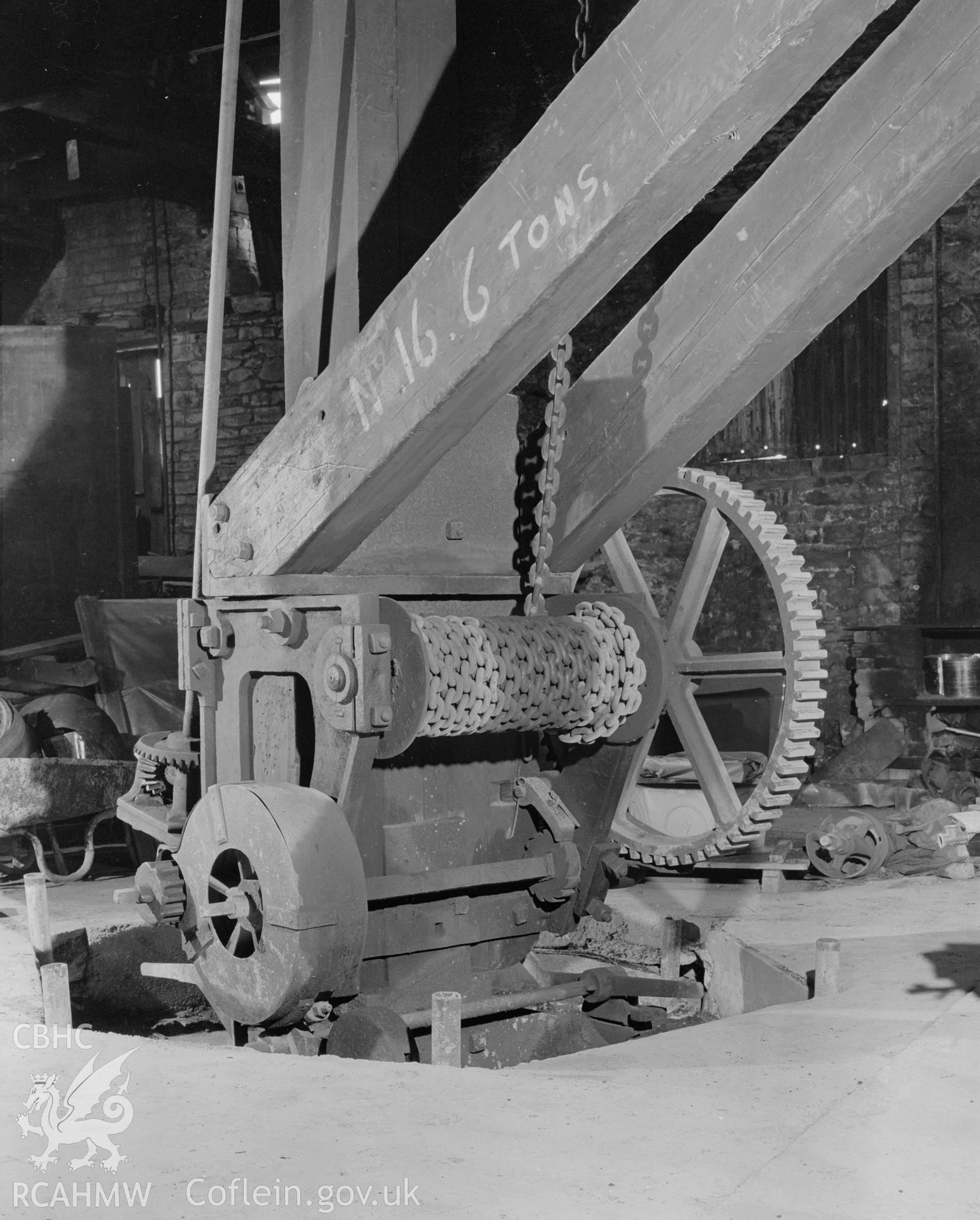 Digital copy of a black and white negative showing detail of the crane at Player's Works Foundry, Clydach, taken by RCAHMW, undated.