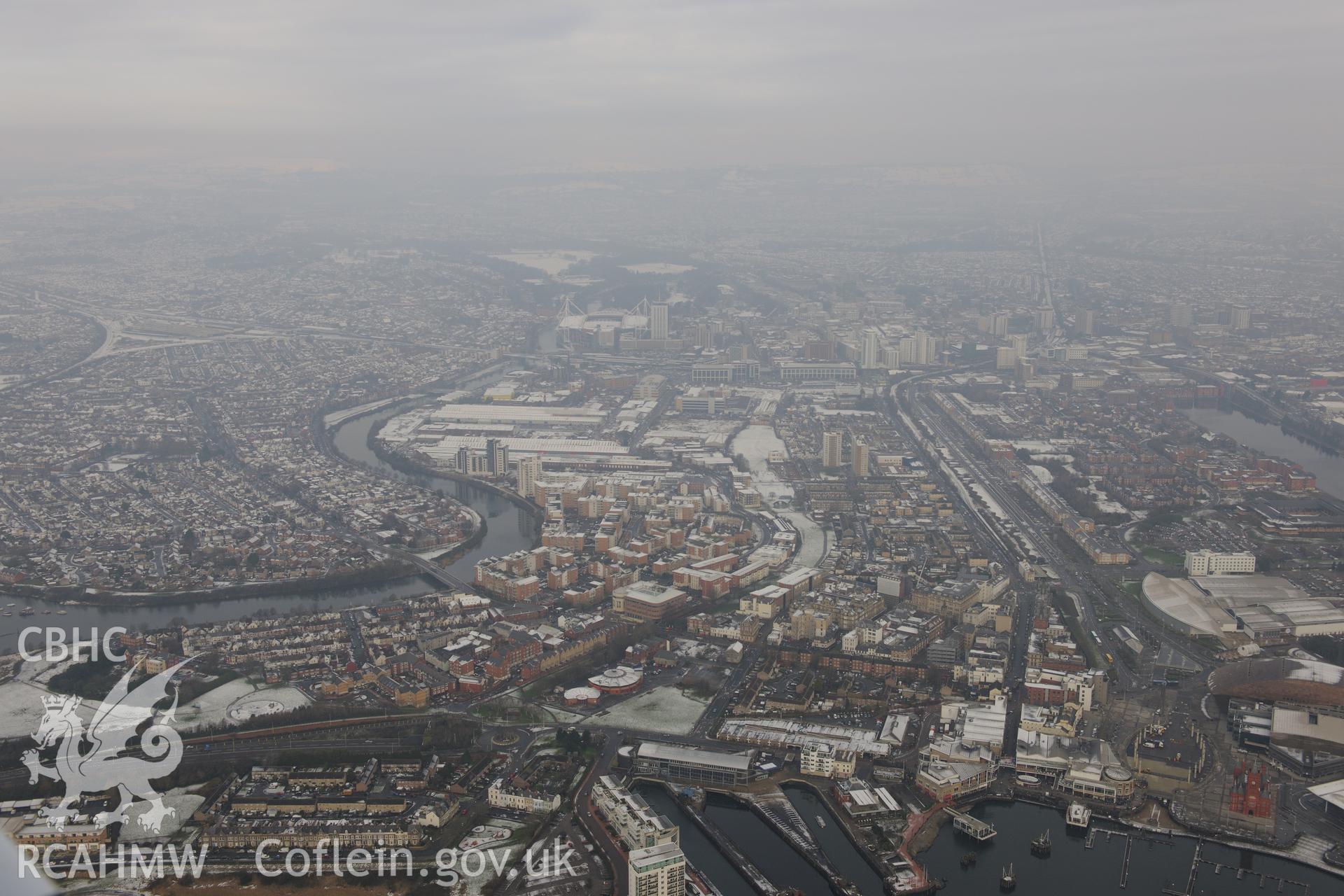 Cardiff, with Techniquest in the foreground and Cardiff Millennium Stadium in the distance. Oblique aerial photograph taken during the Royal Commission?s programme of archaeological aerial reconnaissance by Toby Driver on 24th January 2013.