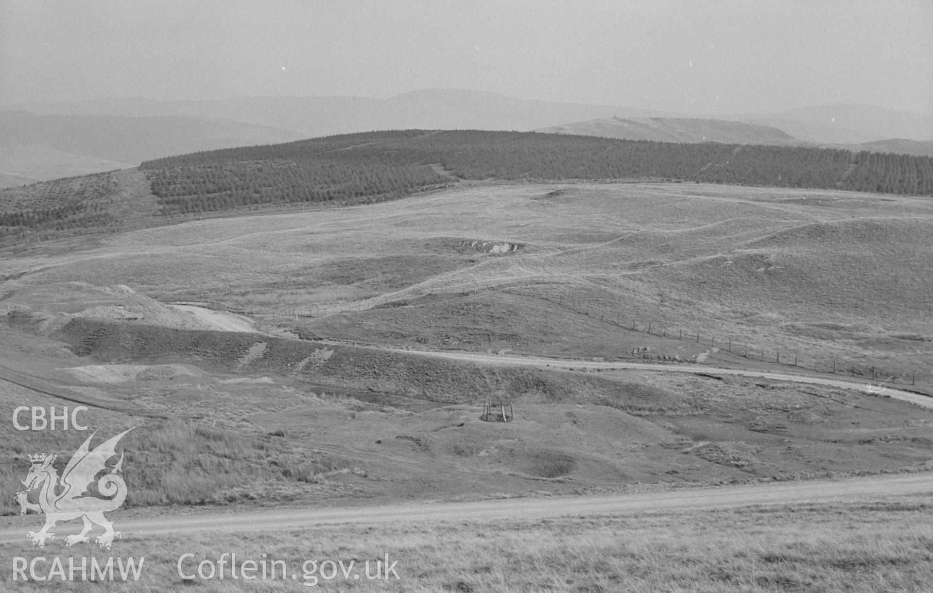 Digital copy of a black and white negative showing panorama of Esgair-Hir mine from Banc Bwlchgarreg; old reservoir on left. Photographed by Arthur O. Chater on 22nd August 1967, looking east from Grid Reference SN 732 913. (Photograph 1 of 3).