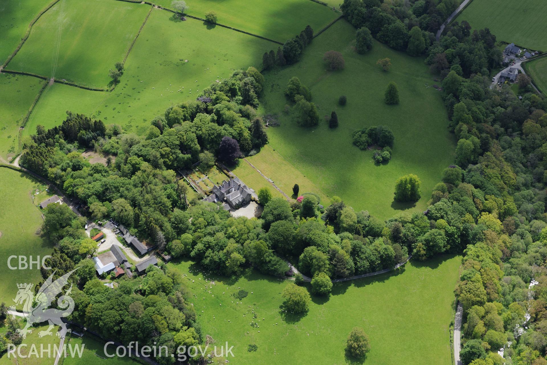 Derw country house and garden and Derw home farm including cowhouse, barn, sawmill, stable and cartshed. Oblique aerial photograph taken during the Royal Commission's programme of archaeological aerial reconnaissance by Toby Driver on 3rd June 2015.