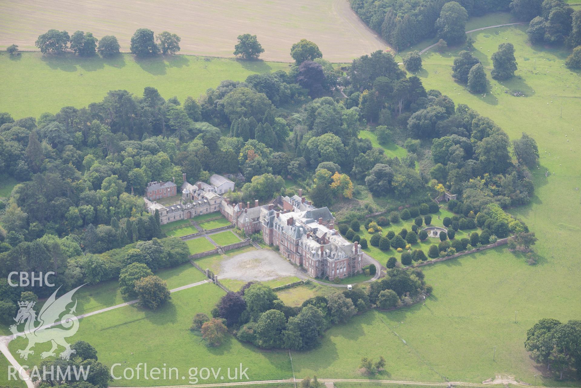 Hall, garden, Venetian garden, and stables, Kinmel Park, Bodelwyddan. Oblique aerial photograph taken during the Royal Commission's programme of archaeological aerial reconnaissance by Toby Driver on 11th September 2015.