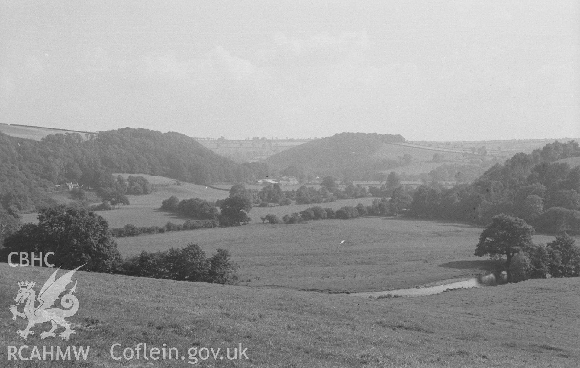 Digital copy of a black and white negative showing view Llanfair and Llanfair Lodge, Llandysul. Photographed by Arthur O. Chater in August 1965 from Troed-y-Rhiw; Craig-Gwrtheyrn camp on right, Grid Reference SN 4306 4202, looking south south east.