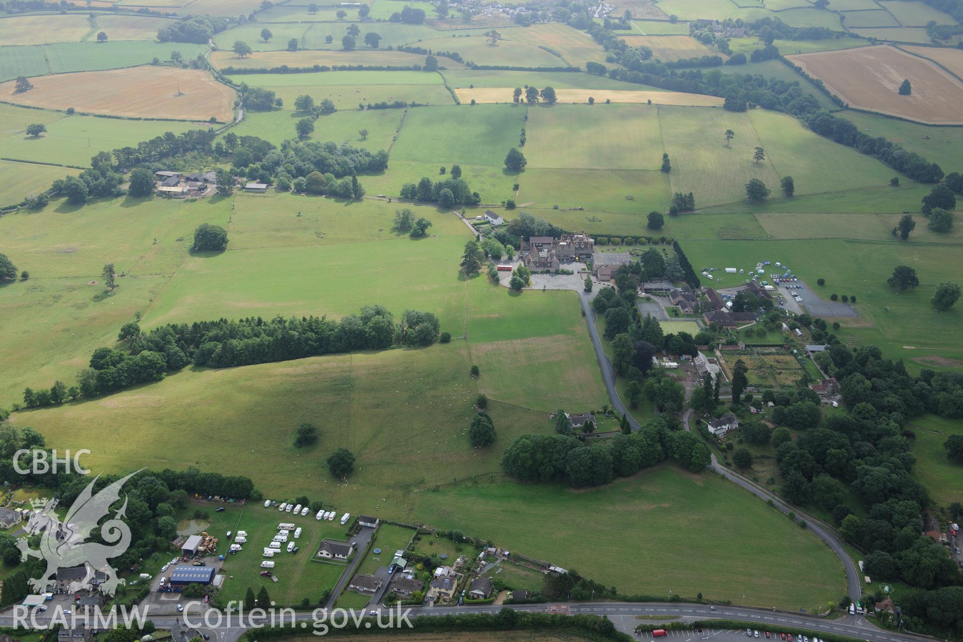 Grounds and gardens of Gwernyfed Park (including the former deer park); Gwernyfed Gaer defended enclosure, and Gwernyfed High School. Oblique aerial photograph taken during the Royal Commission?s programme of archaeological aerial reconnaissance by Toby Driver on 1st August 2013.