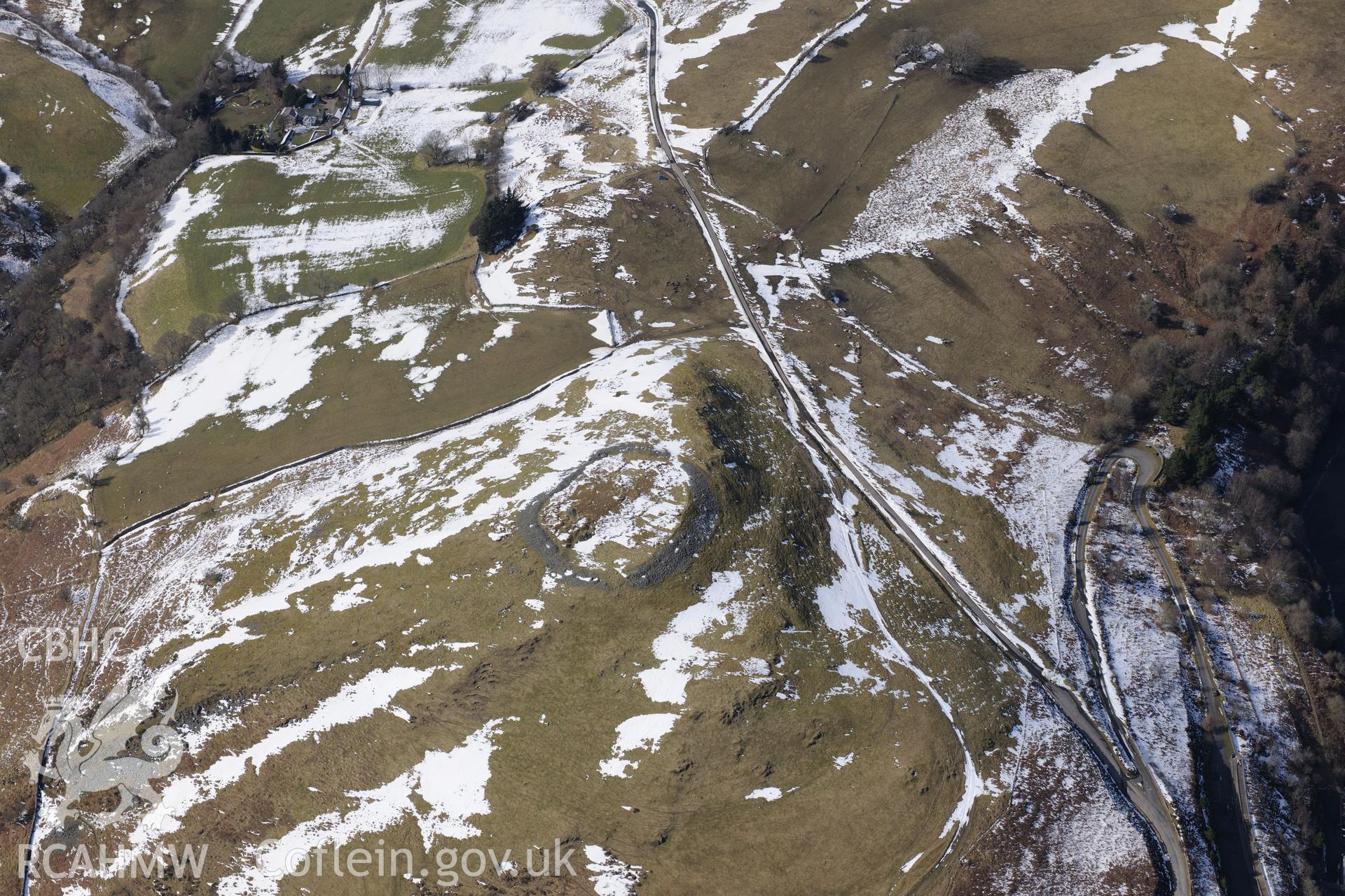 Pen-y-Gaer hillfort, north west of Llanidloes. Oblique aerial photograph taken during the Royal Commission's programme of archaeological aerial reconnaissance by Toby Driver on 2nd April 2013.