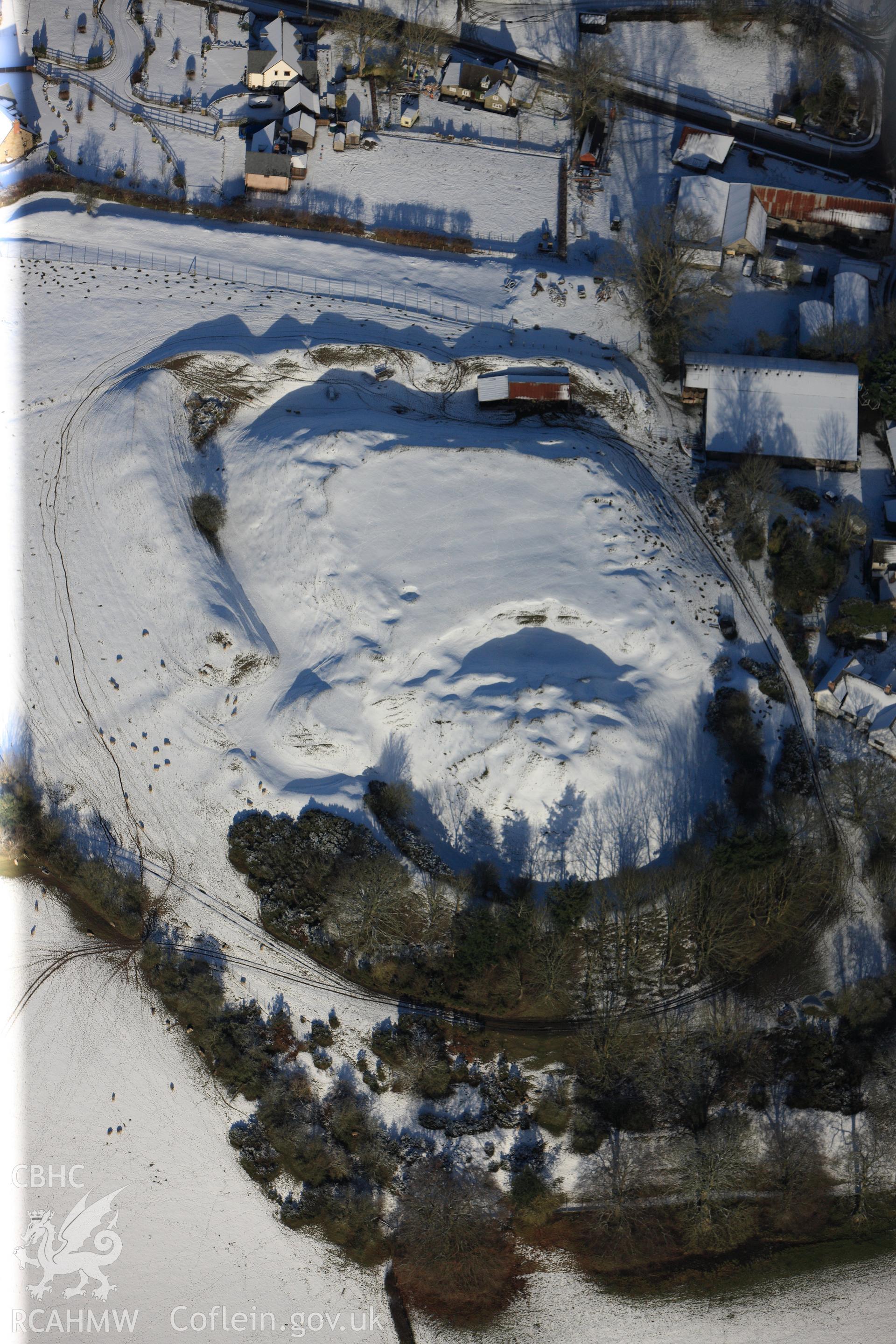 Motte and bailey castle at Painscastle, south east of Builth Wells. Oblique aerial photograph taken during the Royal Commission?s programme of archaeological aerial reconnaissance by Toby Driver on 15th January 2013.