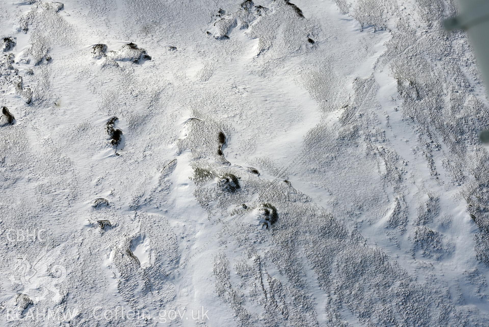 Carn Biga cairn cemetery, north west of Llanidloes. Oblique aerial photograph taken during the Royal Commission's programme of archaeological aerial reconnaissance by Toby Driver on 4th February 2015.