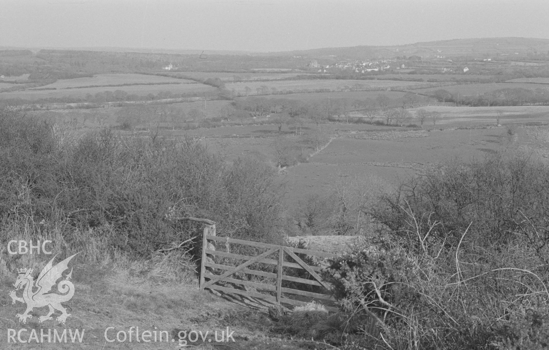 Digital copy of a black and white negative showing Cilgerran from the top of the lane 200m north of Nantperchellan farm. Photographed by Arthur O. Chater on 9th April 1968 looking east from Grid Reference SN 173 435.