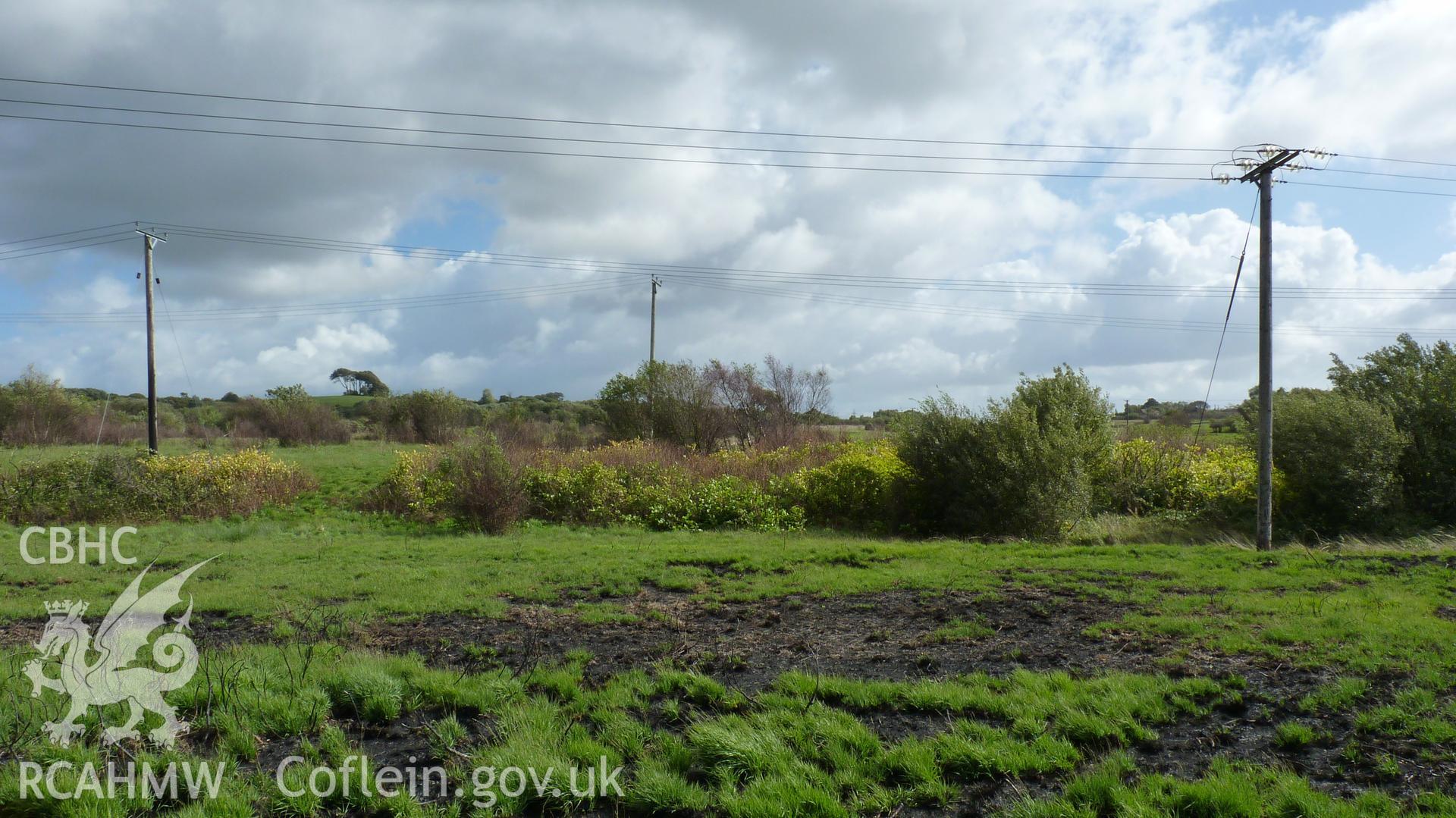 View from Carn Goch, looking southeast across raised ground (largely landscaped colliery waste). Photographed during Setting Impact Assessment of Land off Phoenix Way, Garngoch Business Village, carried out by Archaeology Wales, 2018. Project number P2631.