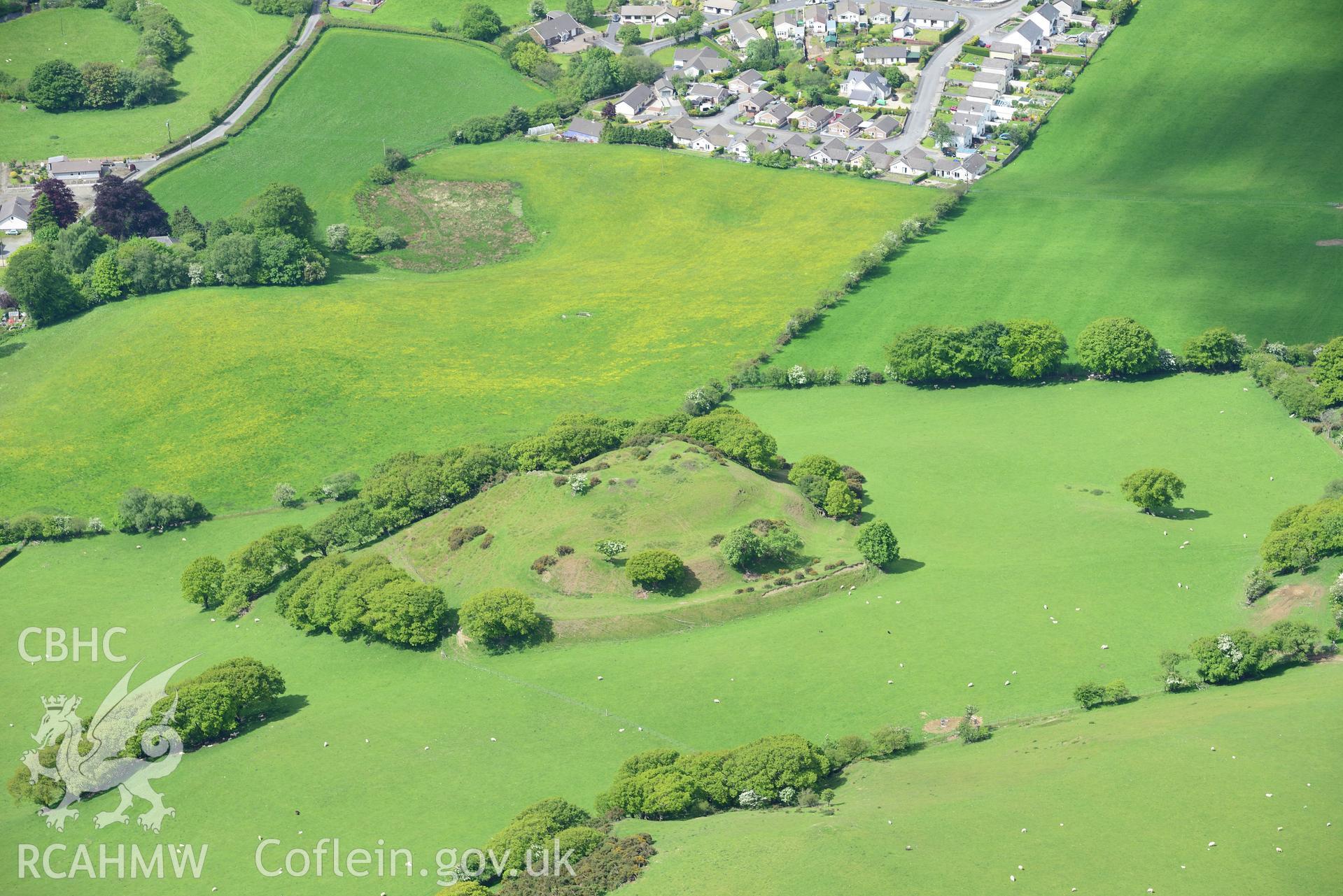 Castell Tregaron and the outskirts of Tregaron town. Oblique aerial photograph taken during the Royal Commission's programme of archaeological aerial reconnaissance by Toby Driver on 3rd June 2015.