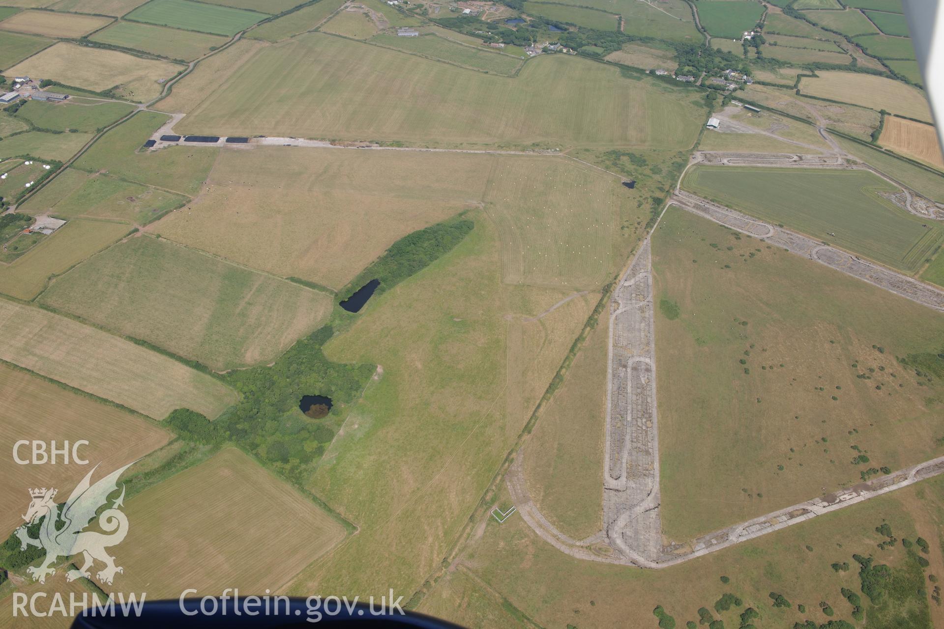 Uncertain cropmarks at Talbenny Airfield (SM 829 112). Oblique aerial photograph taken during the Royal Commission?s programme of archaeological aerial reconnaissance by Toby Driver on 16th July 2013.