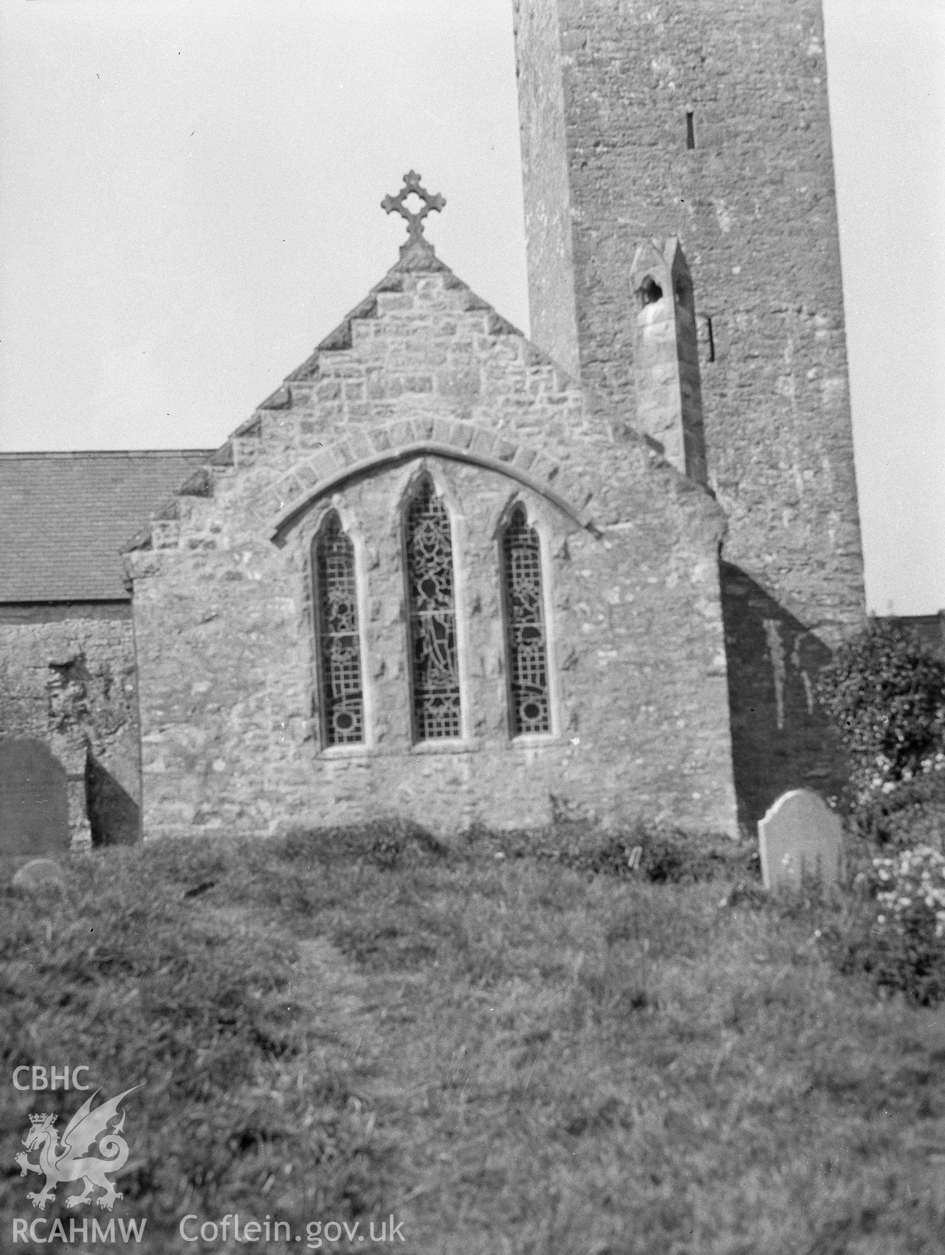 Digital copy of a nitrate negative showing exterior view of tower and east end of St James's Church, Manorbier. From the National Building Record Postcard Collection.