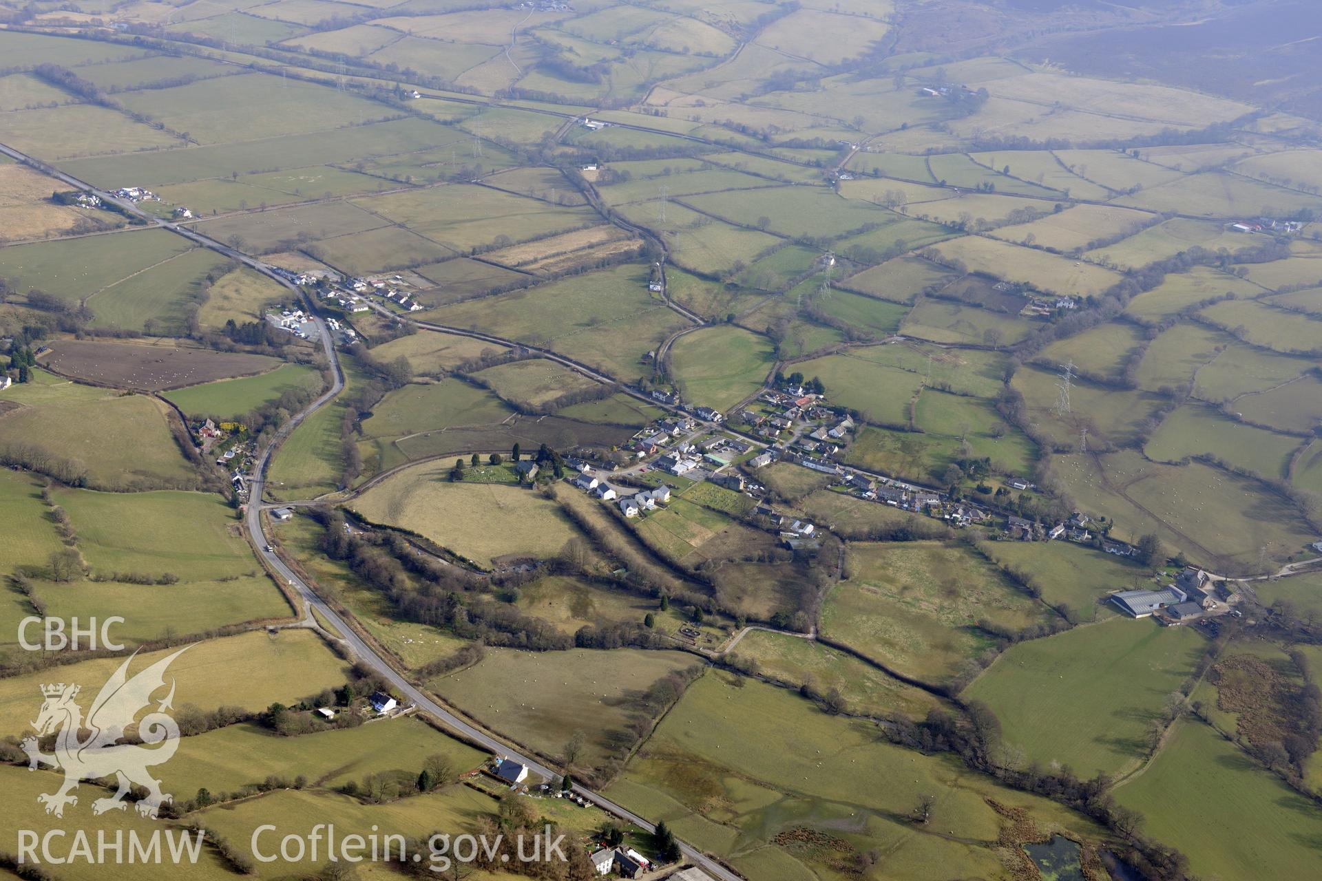 Bryneglwys village, north west of Llangollen. Oblique aerial photograph taken during the Royal Commission?s programme of archaeological aerial reconnaissance by Toby Driver on 28th February 2013.