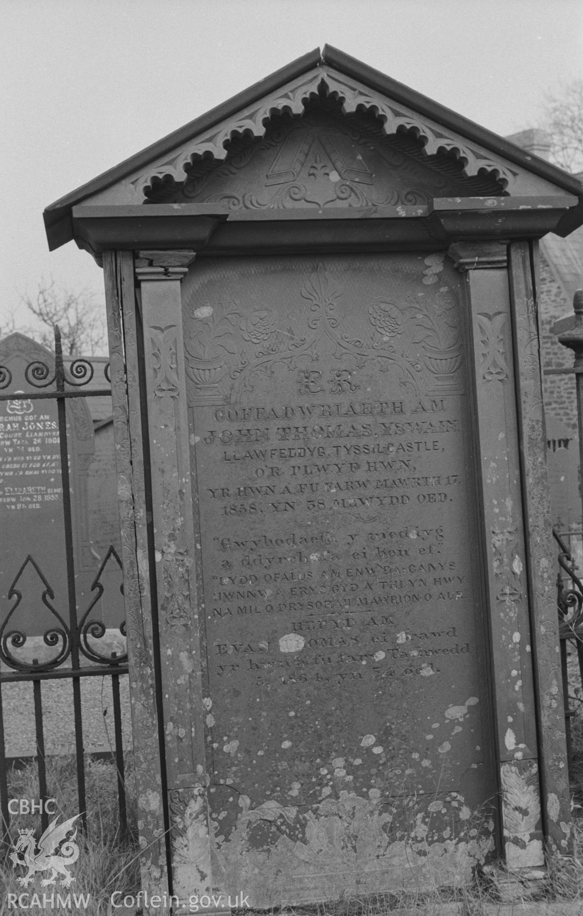 Digital copy of a black and white negative showing gravestone in memory of members of the Thomas family, including the surgeon John Thomas, of Tyssil Castle, at Capel Pant-y-Defaid, Prengwyn, Llandysul. Photographed by Arthur O. Chater in April 1967.