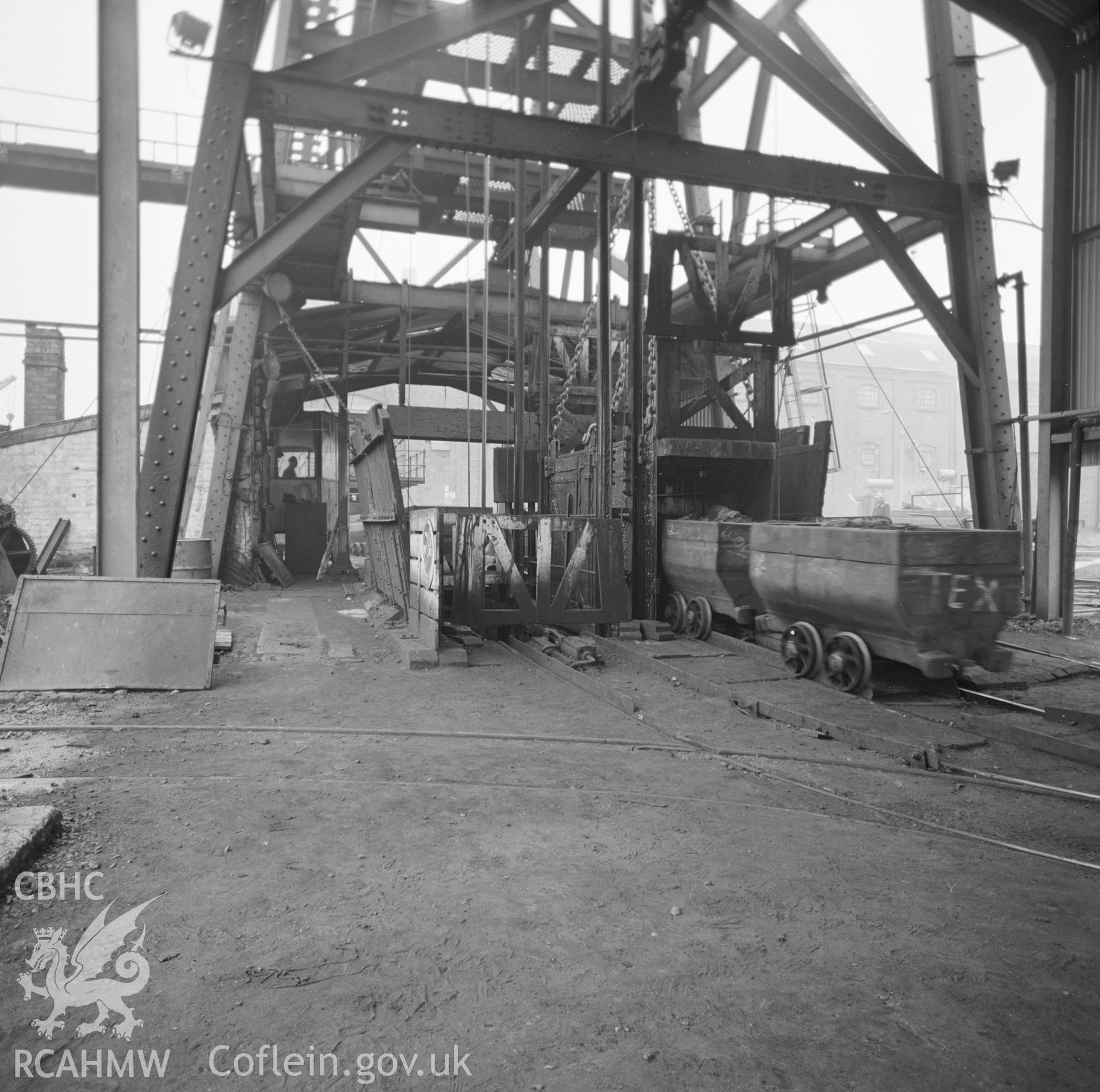 Digital copy of an acetate negative showing trams of coal on the coaling shaft at Penallta Colliery, from the John Cornwell Collection.