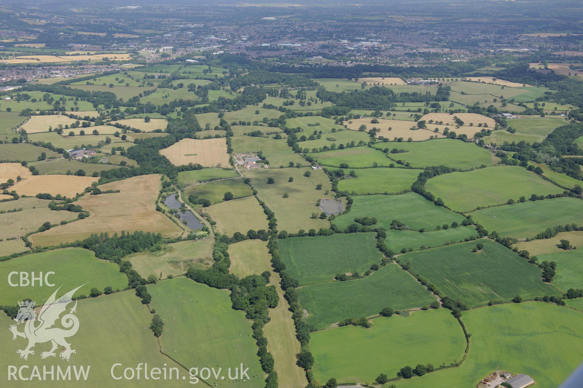 Middle Sontley Farm and the section of Wat's Dyke extending from Middle Sontley to Black Brook Bridge. Oblique aerial photograph taken during the Royal Commission's programme of archaeological aerial reconnaissance by Toby Driver on 30th July 2015.