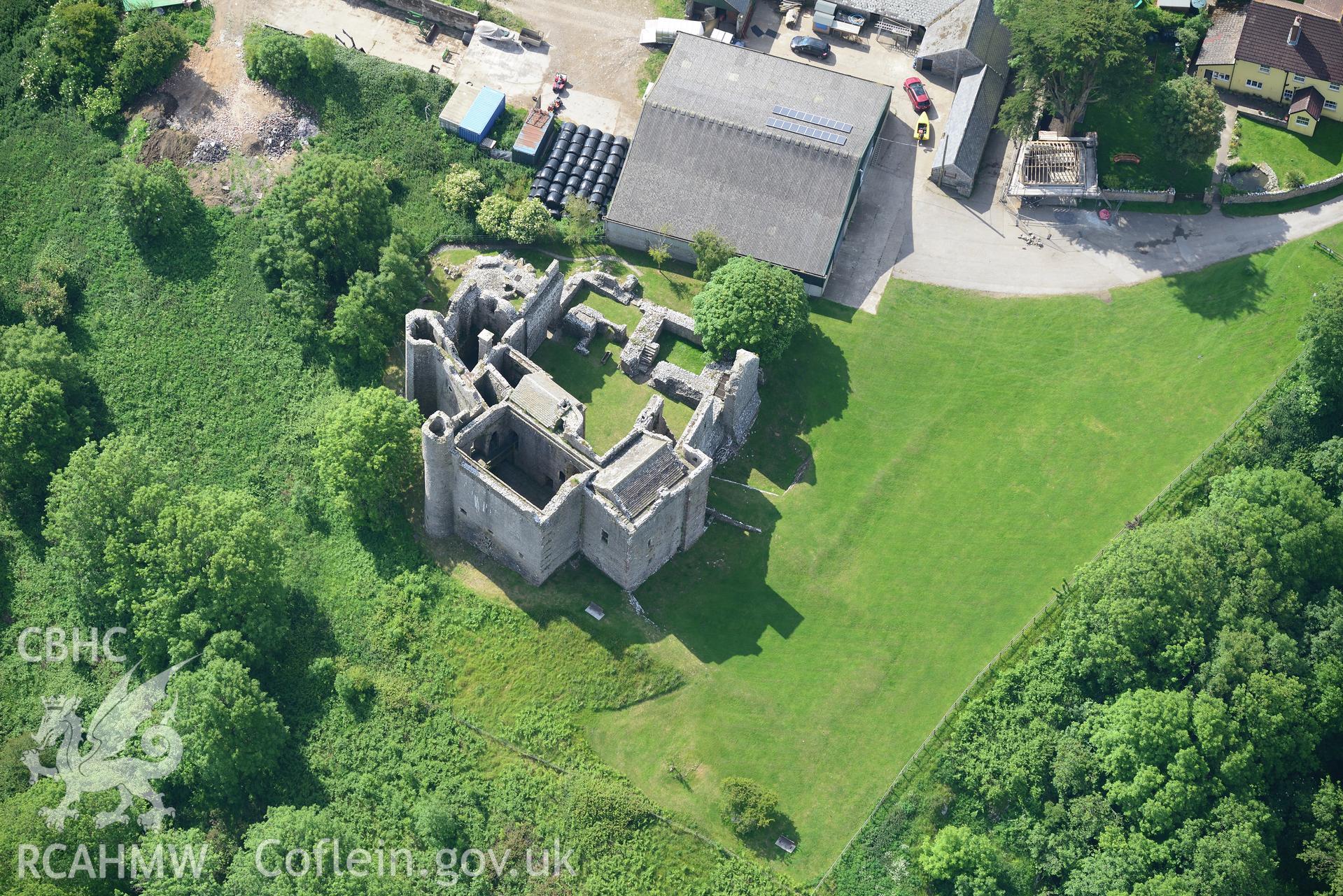 Wallas farm and earthworks showing the remains of Weobley Castle. Oblique aerial photograph taken during the Royal Commission's programme of archaeological aerial reconnaissance by Toby Driver on 19th June 2015.