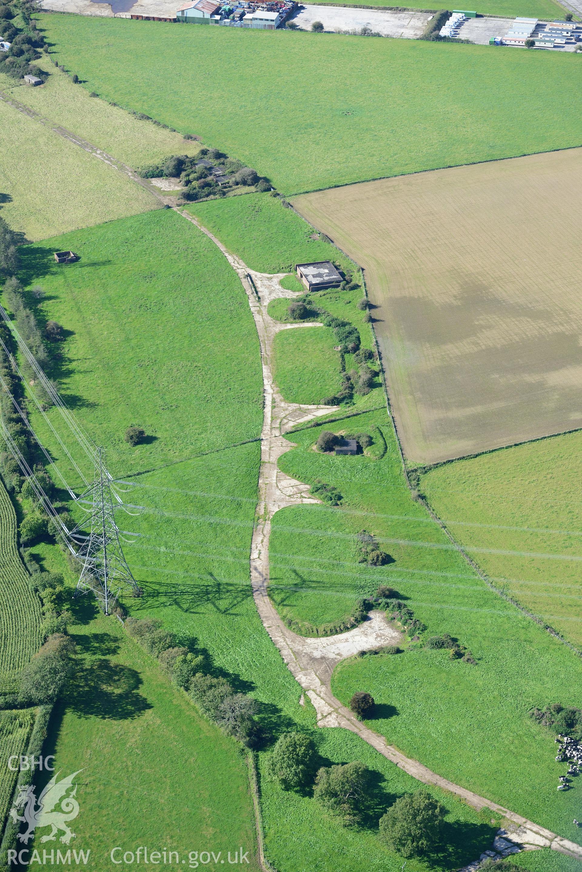 Carew Cheriton Airfield. Oblique aerial photograph taken during the Royal Commission's programme of archaeological aerial reconnaissance by Toby Driver on 30th September 2015.