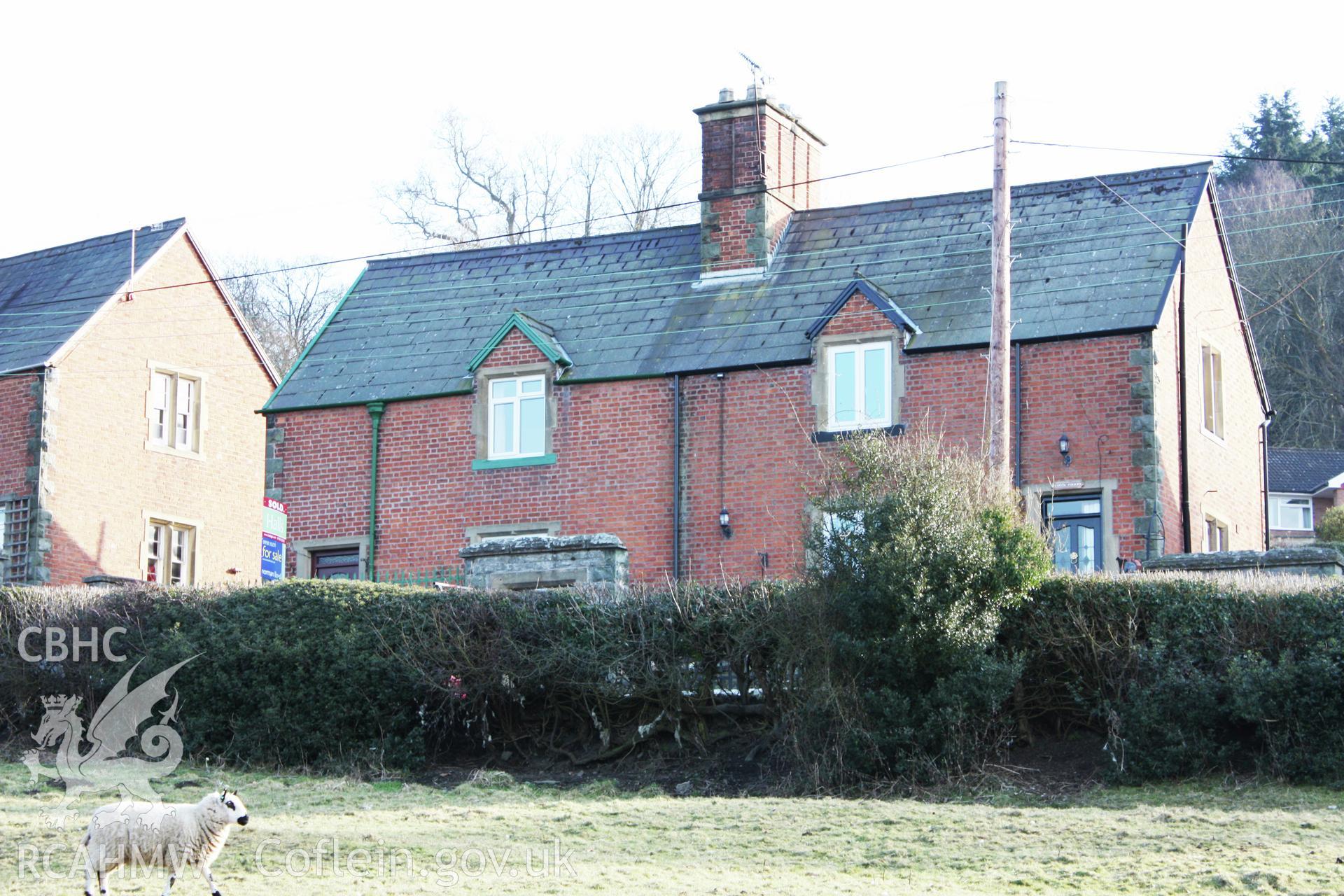 Colour photograph showing red brick exterior of Pentre Cottages, Leighton. Photographed during survey conducted by Geoff Ward on 11th July 2009.