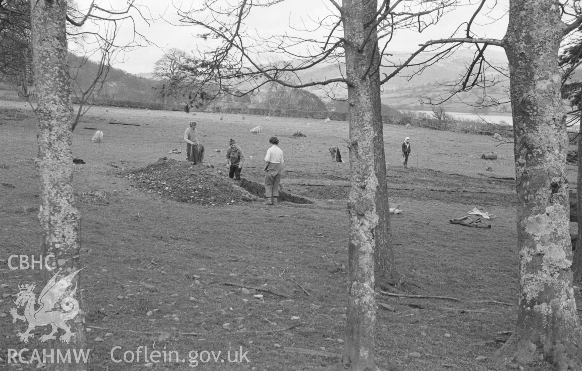 Digital copy of a black and white negative showing excavations at Caer Gai Roman fort, north of Llanuwchllyn. Photographed by Arthur O. Chater in April 1965.