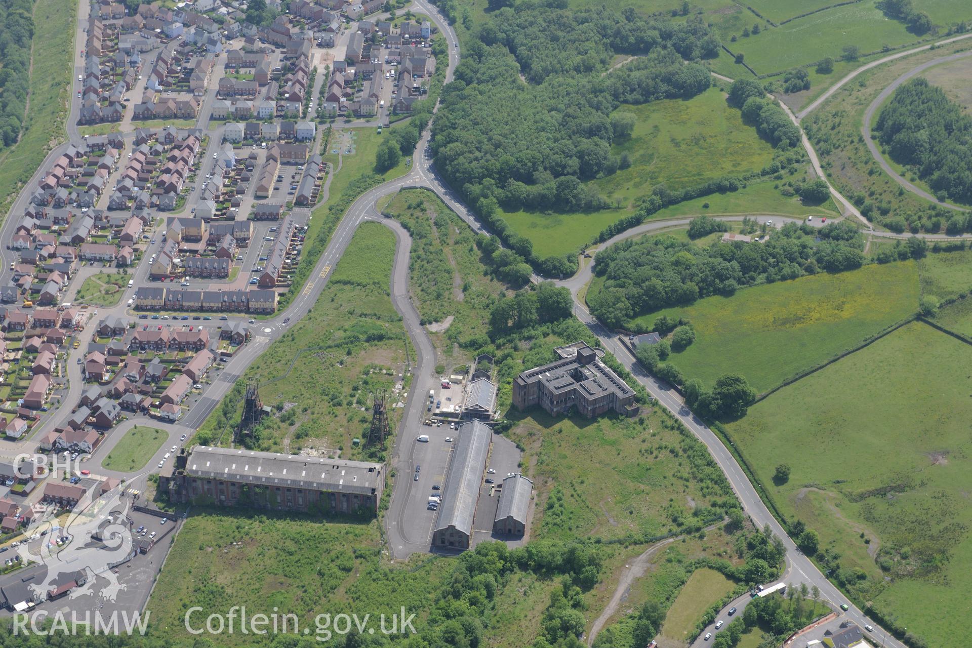 Penallta Colliery, Ystrad Mynach, including views of headframe shafts no. 1 and 2; pithead baths and canteen, powerhouse and workshops. Oblique aerial photograph taken during the Royal Commission's programme of archaeological aerial reconnaissance by Toby Driver on 11th June 2015.