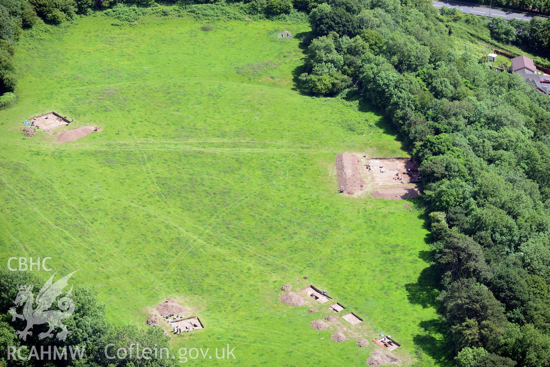 Excavation of Caerau Hillfort, Ely, conducted by Cardiff University. Oblique aerial photograph taken during the Royal Commission's programme of archaeological aerial reconnaissance by Toby Driver on 29th June 2015.