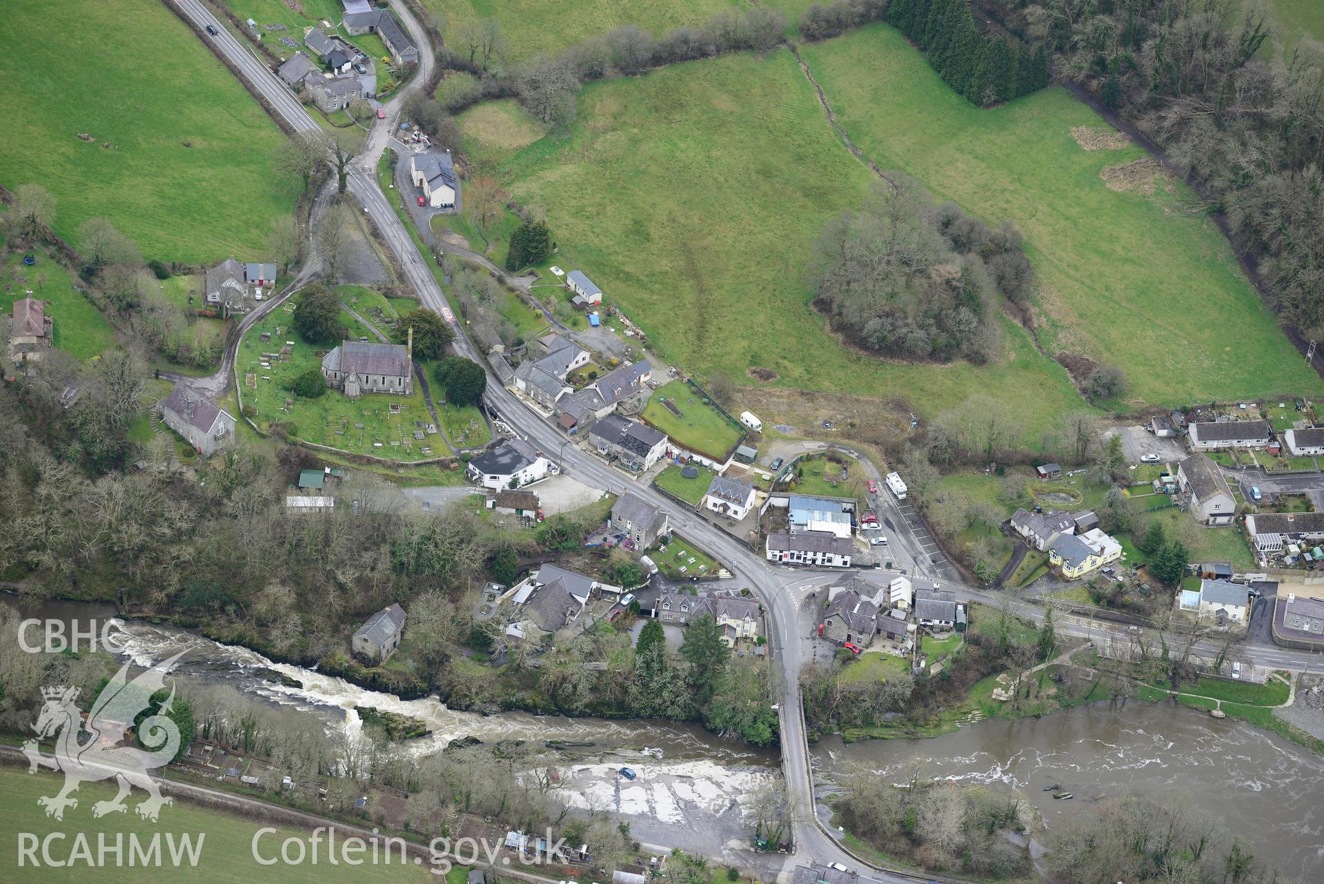 St. Llawddog's church, Parc-y-Dommen motte and Cenarth bridge, Cenarth. Oblique aerial photograph taken during the Royal Commission's programme of archaeological aerial reconnaissance by Toby Driver on 13th March 2015.