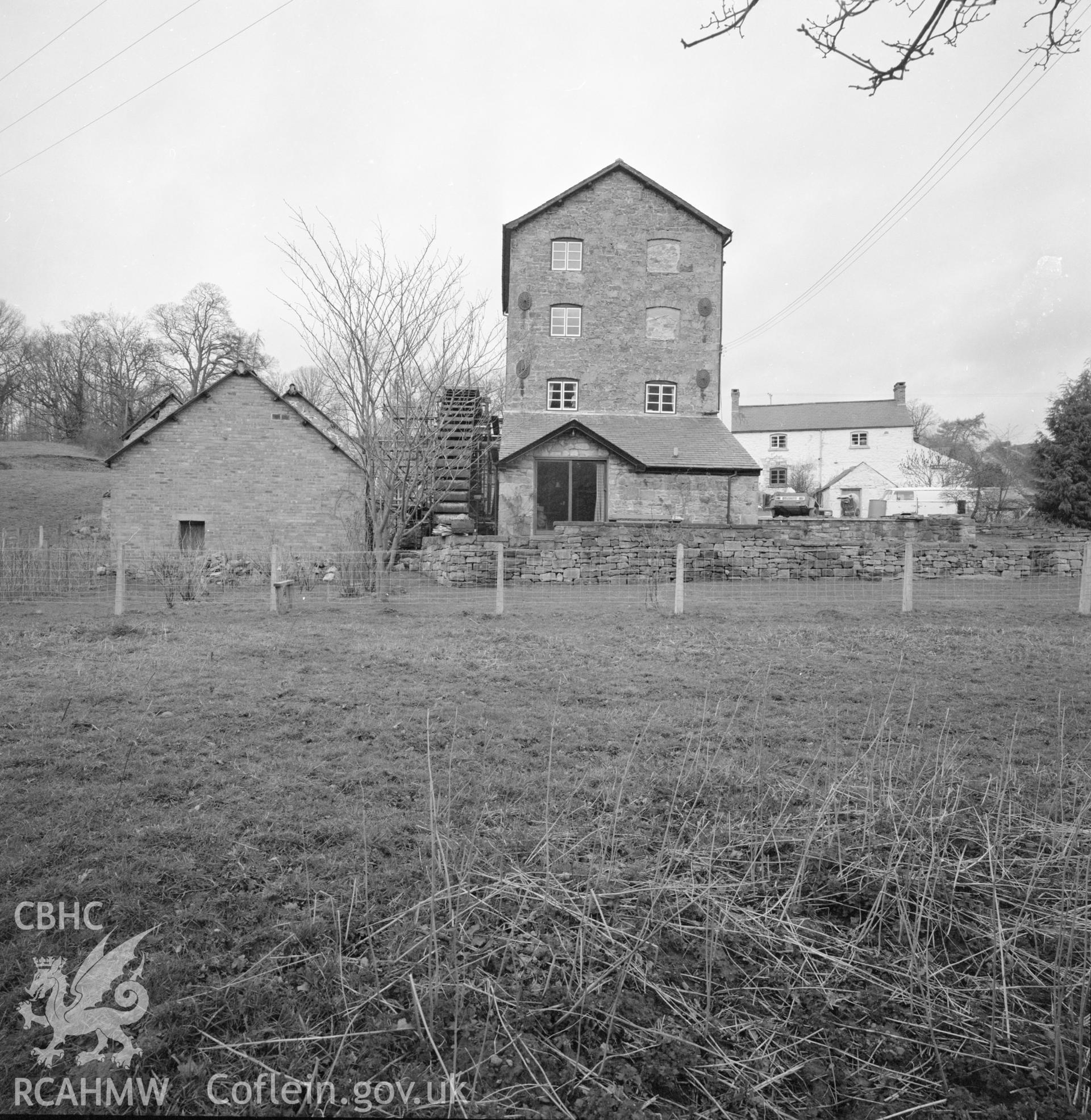 Digital copy of a black and white negative showing exterior view of Trevor Old Mill taken by RCAHMW, 1987.