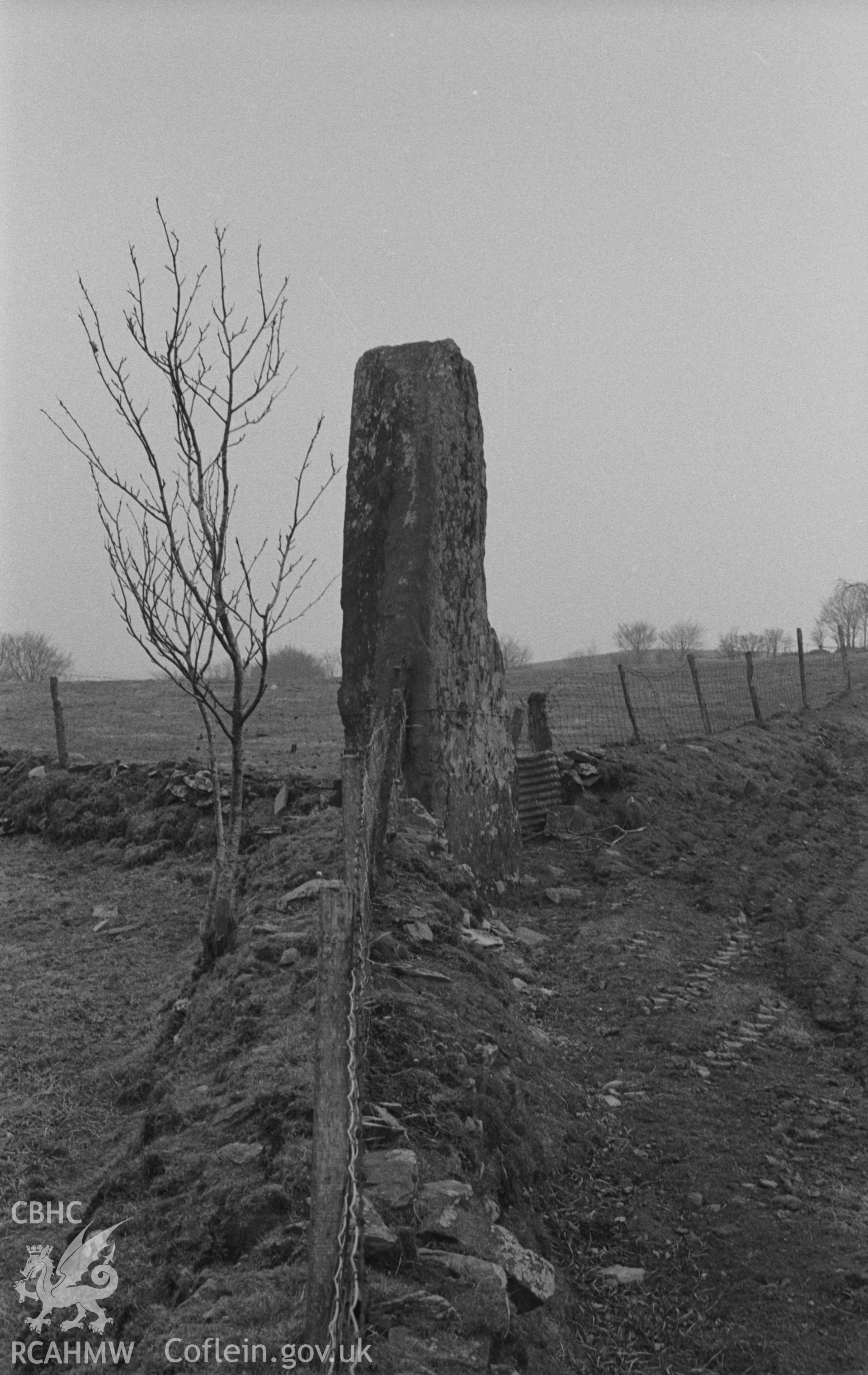 Digital copy of a black and white negative showing Carreg Hirfaen, Llanycrwys, defining the border between Ceredigion and Carmarthenshire. Photographed in April 1963 by Arthur O. Chater from Grid Reference SN 6247 4647, looking south west.