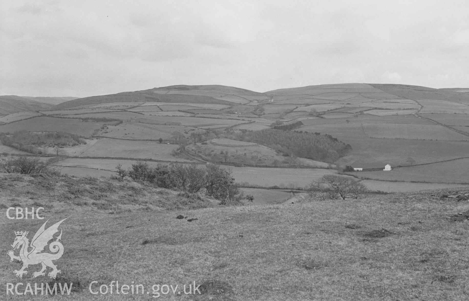 Black and White photograph showing Cae Llety Llwyd (centre) from Cae Allt-Goch, Talybont. Photographed by Arthur Chater in April 1963, from Grid Reference SN 641 882, looking east.