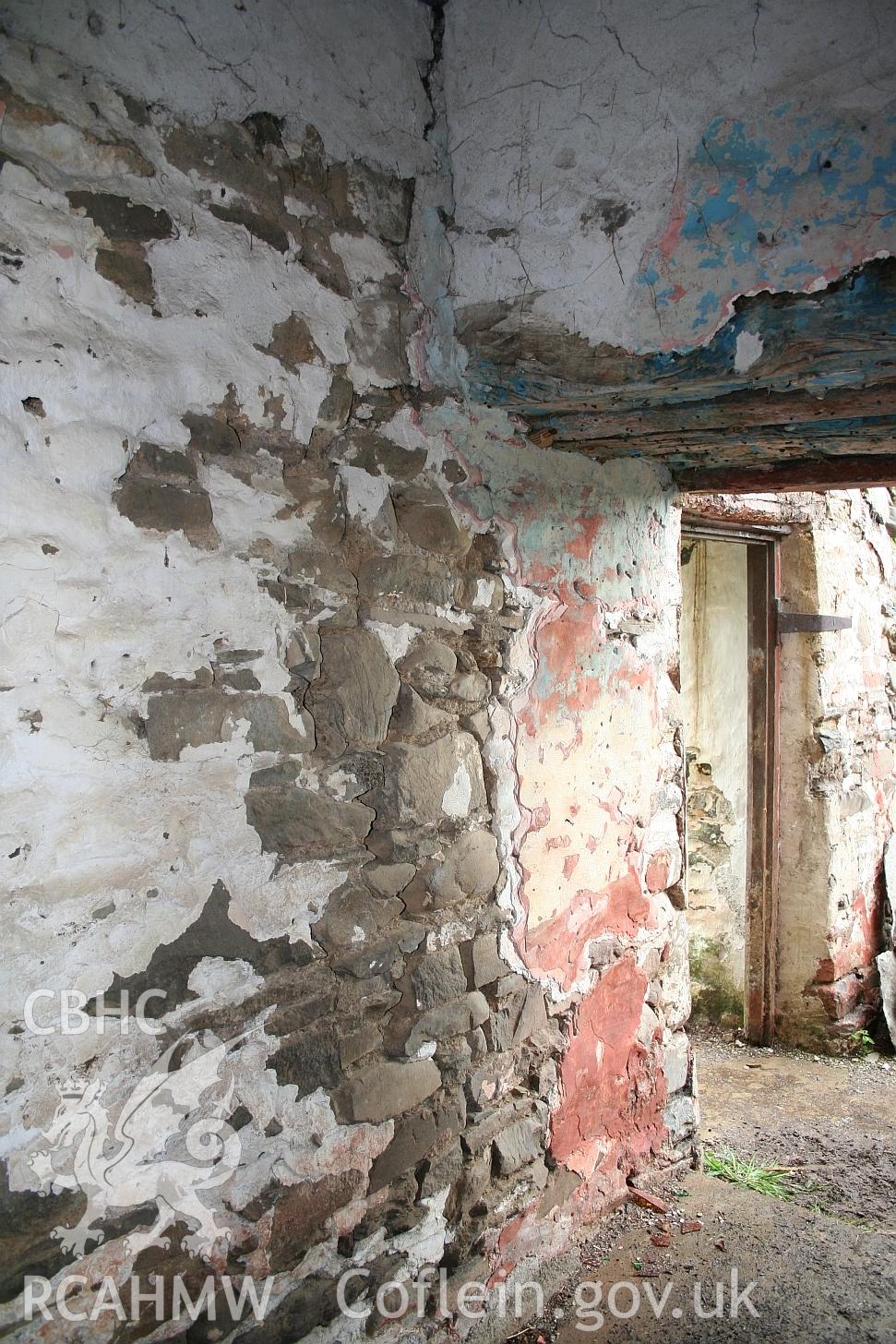 Dwelling end of Allt Ddu farmhouse, entrance to living roomand main entrance beyond, red ochre wash.