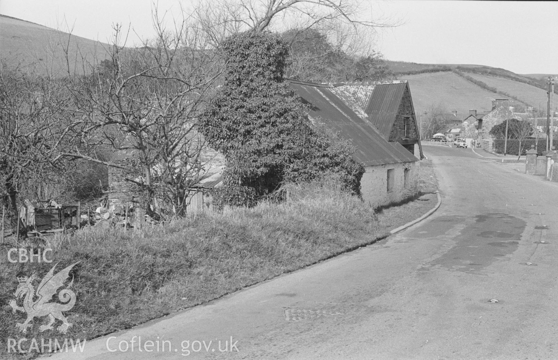 Black and White photograph showing Yarn Factory from the road will millpond on the right, Llanrhystyd. Photographed by Arthur Chater in April 1963 from Grid Reference SN 539 696, looking north west.