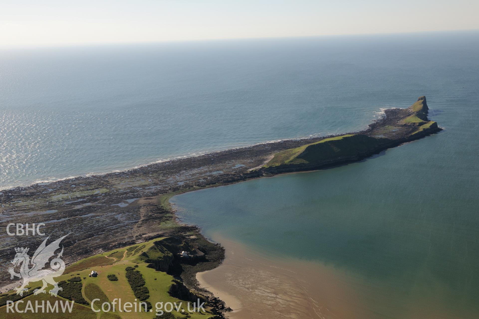 Worm's Head and the enclosure on its north eastern side, near Rhossili, on the western coast of the Gower Peninsula. Oblique aerial photograph taken during the Royal Commission's programme of archaeological aerial reconnaissance by Toby Driver on 30th September 2015.