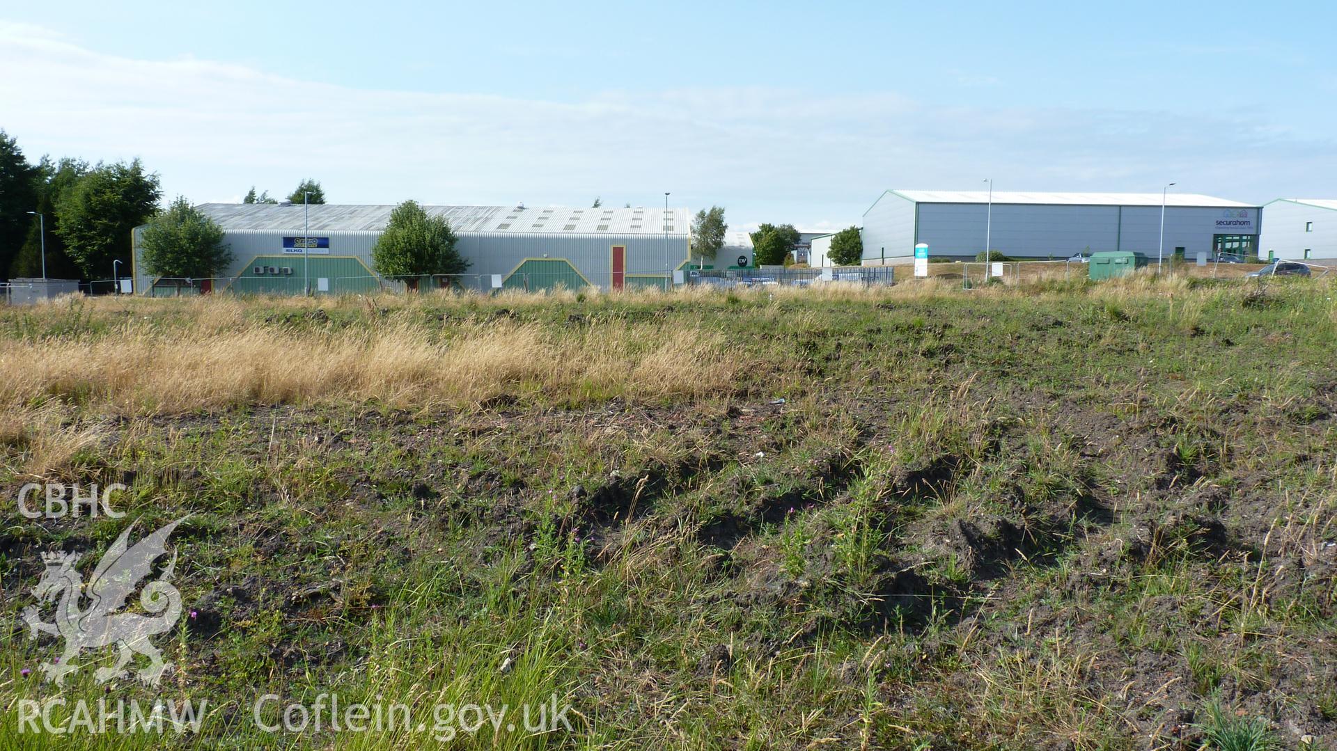 View north across proposed development area, showing indutrial units on north side of Phoenix Way. Photographed for Setting Impact Assessment of land near Garngoch Business Village, Swansea, by Archaeology Wales, 2018. Project number P2631.