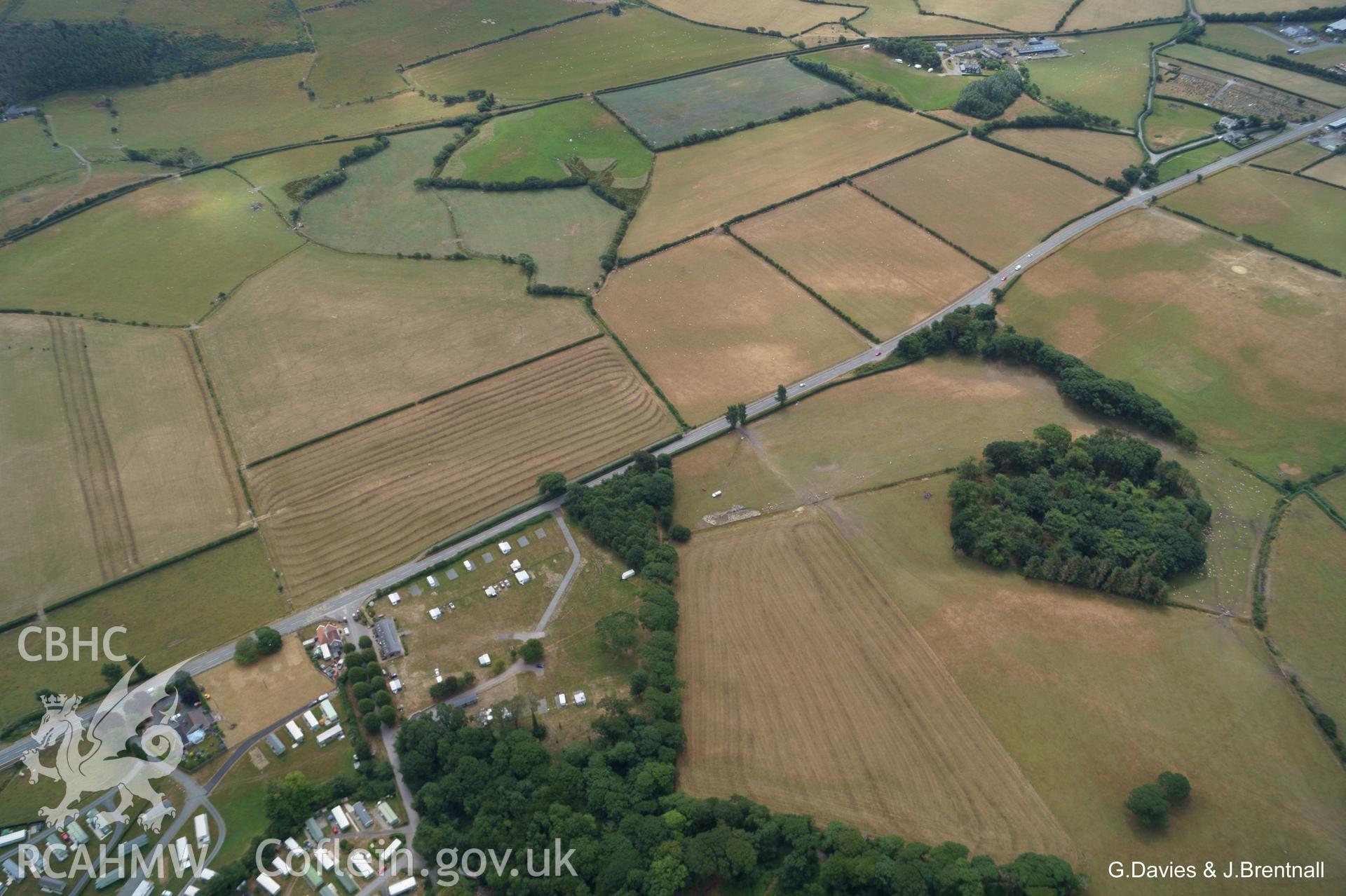 Wide shot aerial photograph of Square Barrow Cemetery & cropmarks near Ynysmaengwyn, taken by Glyn Davies & Jonathan Brentnall 16/07/2018 under drought conditions. Original Photograph. For modified version with clearer view of archaeology see BDC_04_03_03.