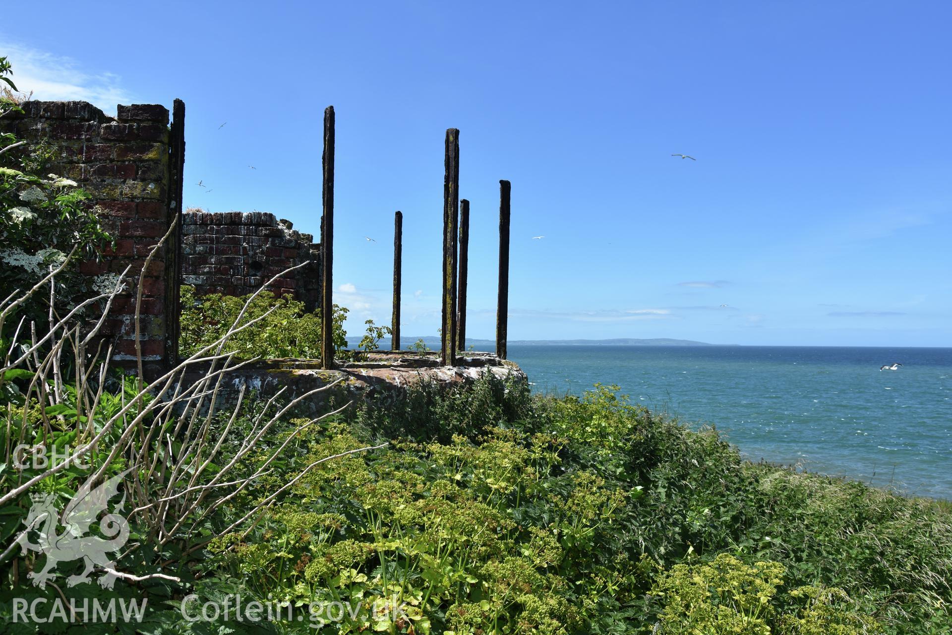 Investigator's photographic survey of the Telegraph Station on Puffin Island or Ynys Seiriol for the CHERISH Project. View of remains of panoramic observation window. ? Crown: CHERISH PROJECT 2018. Produced with EU funds through the Ireland Wales Co-operation Programme 2014-2020. All material made freely available through the Open Government Licence.