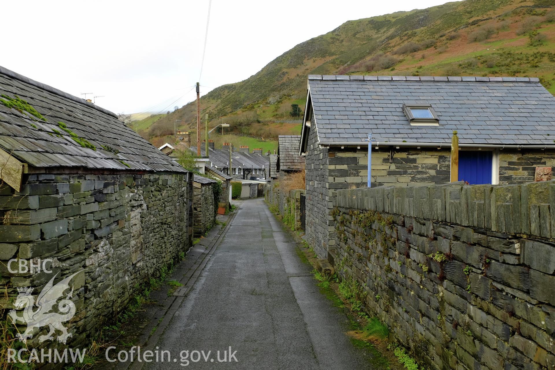 Colour photograph showing view looking north at alleyway (former tramroad) between Heol y Dwr and Heol Llanegryn, Abergynolwyn, produced by Richard Hayman 7th February 2017