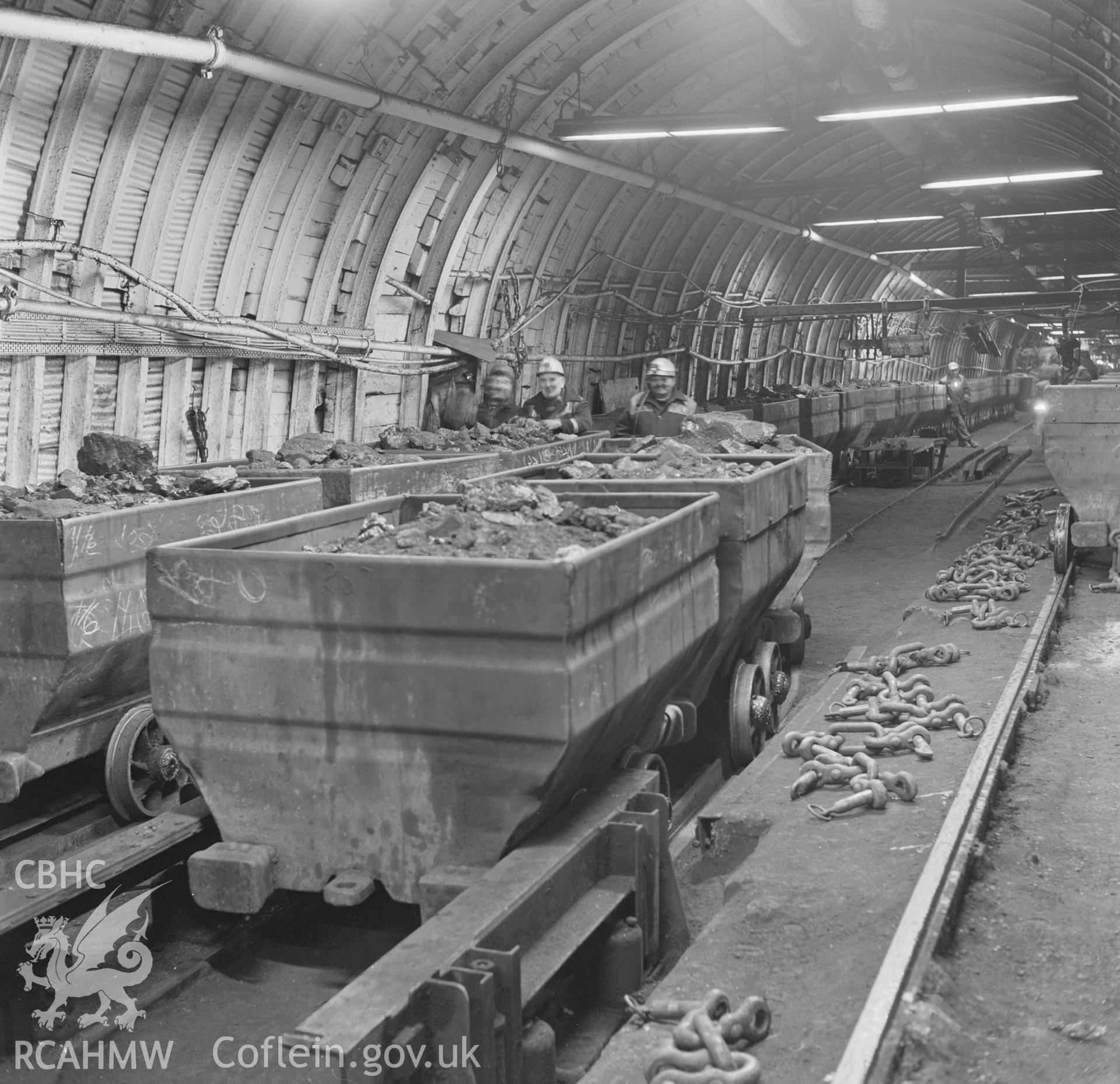 Digital copy of an acetate negative showing coal trams at pit bottom at Penallta Colliery from the John Cornwell Collection.