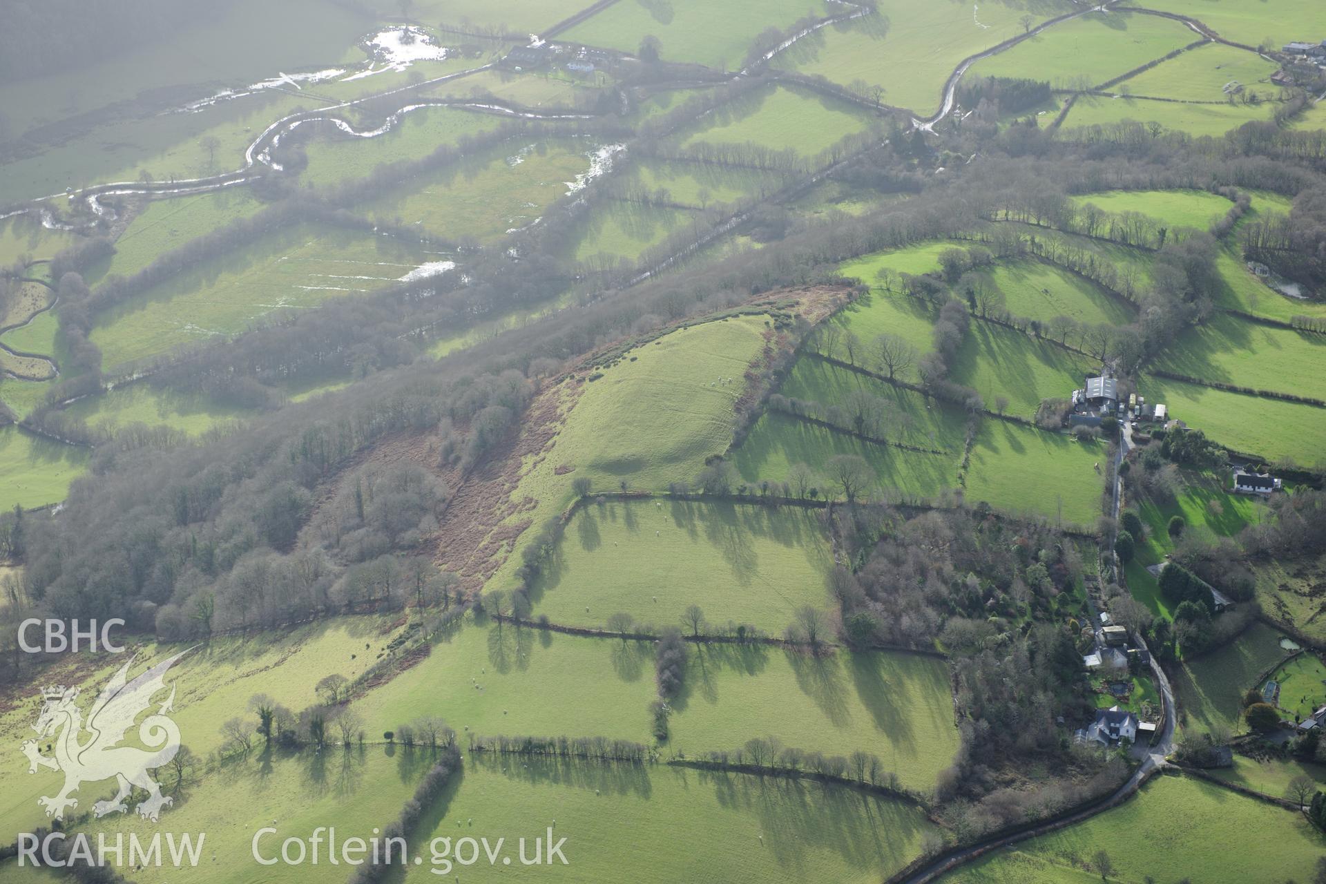 Pen-y-Gaer farm cottage, defended enclosure and Persondy. Oblique aerial photograph taken during the Royal Commission's programme of archaeological aerial reconnaissance by Toby Driver on 6th January 2015.