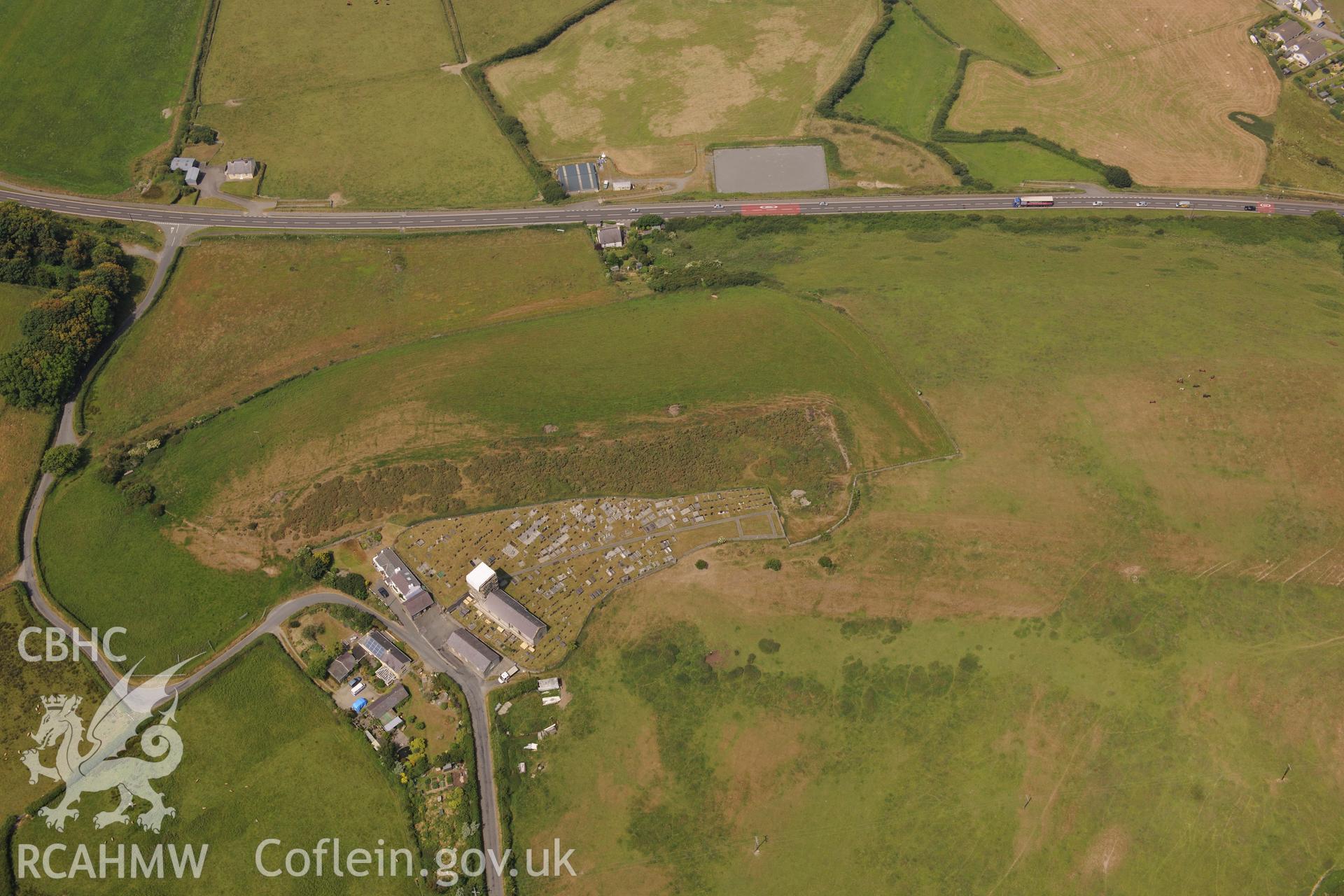 Hillfort, St David's Church, and Sunday School at Llanddewi Aberarth, south west of Aberystwyth. Oblique aerial photograph taken during the Royal Commission?s programme of archaeological aerial reconnaissance by Toby Driver on  12th July 2013.