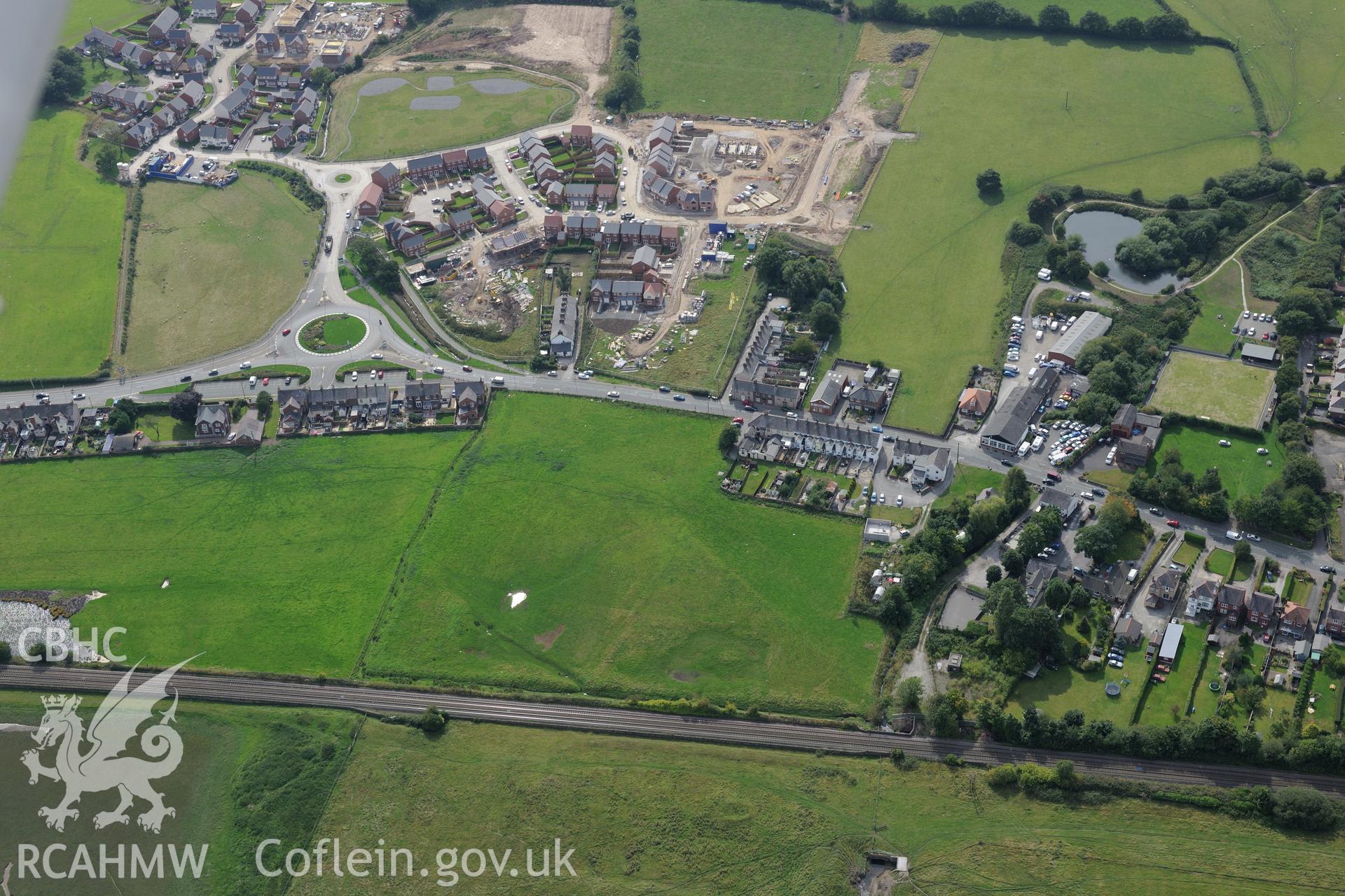 Pentre Bridge Roman settlement and new housing development- Bennet's Row, Flint. Oblique aerial photograph taken during the Royal Commission's programme of archaeological aerial reconnaissance by Toby Driver on 11th September 2015.