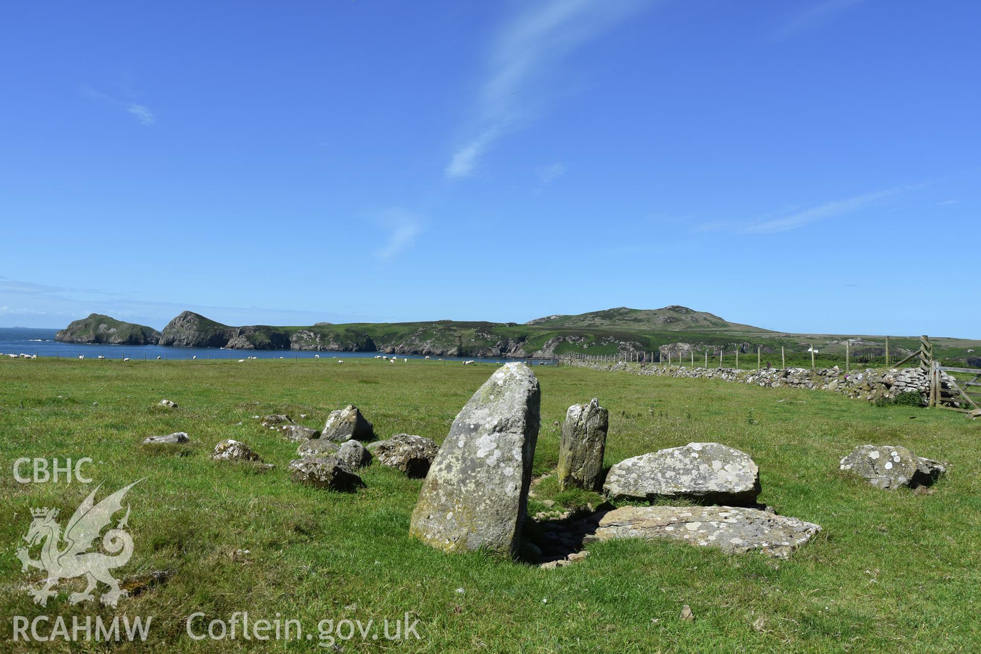 Lower Treginnis chambered tomb. View looking west towards Ramsey Island. Investigator?s photographic survey for the CHERISH Project. ? Crown: CHERISH PROJECT 2019. Produced with EU funds through the Ireland Wales Co-operation Programme 2014-2020. All material made freely available through the Open Government Licence.