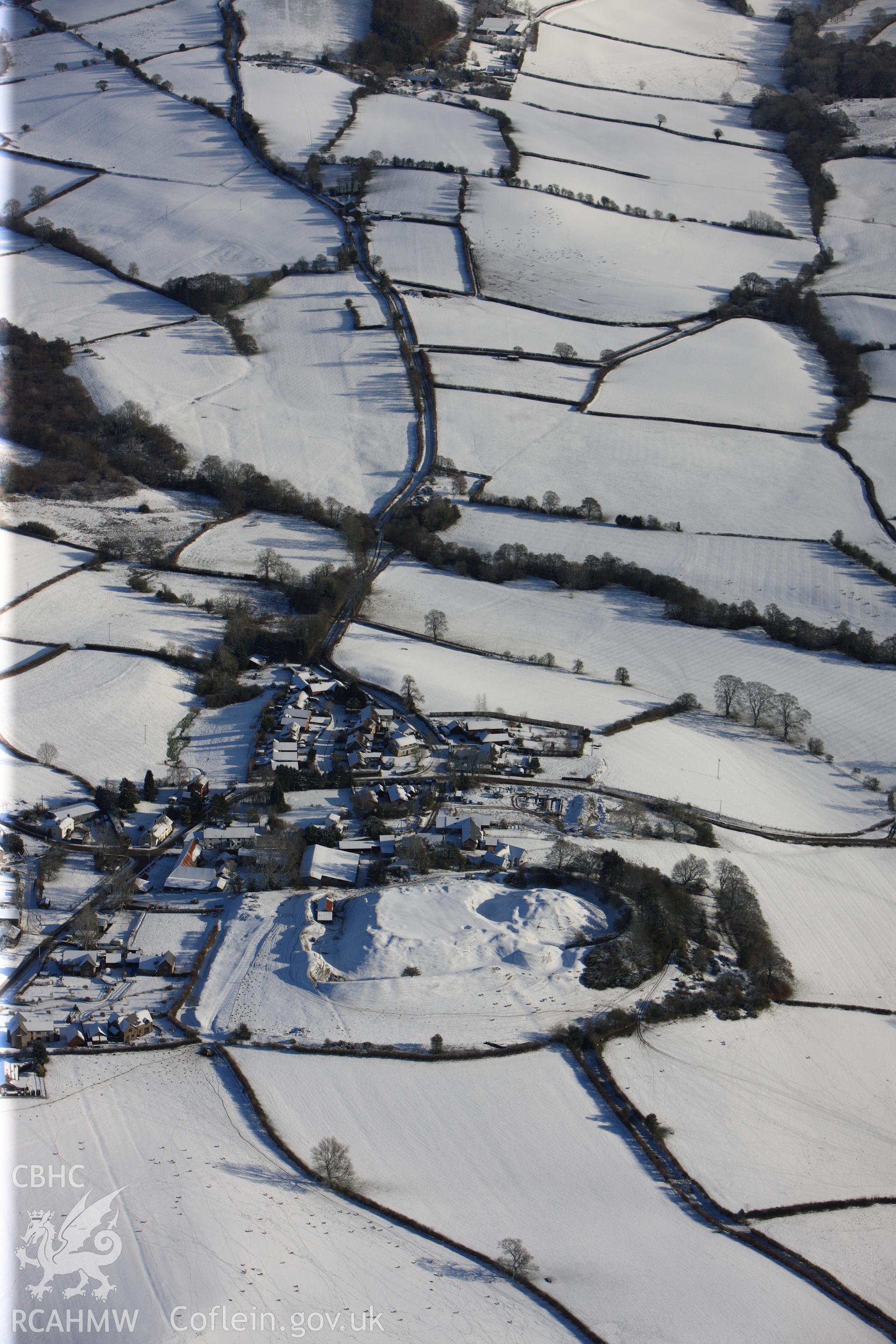 Motte and bailey castle at Painscastle, south east of Builth Wells. Oblique aerial photograph taken during the Royal Commission?s programme of archaeological aerial reconnaissance by Toby Driver on 15th January 2013.