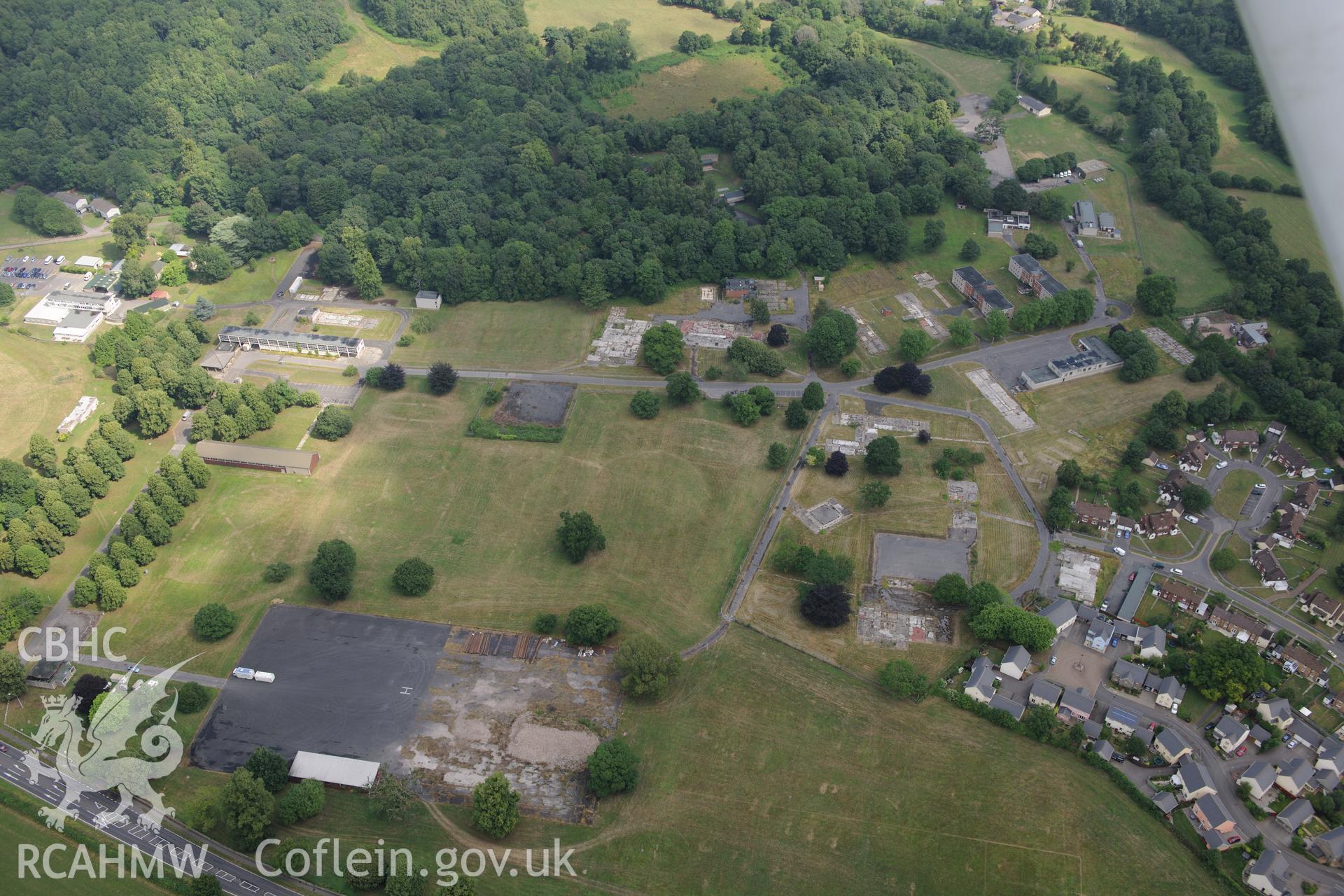 Cwrt-y-Gollen house, garden and army camp, south east of Crickhowell. Oblique aerial photograph taken during Royal Commission?s programme of archaeological aerial reconnaissance by Toby Driver on 1st August 2013.