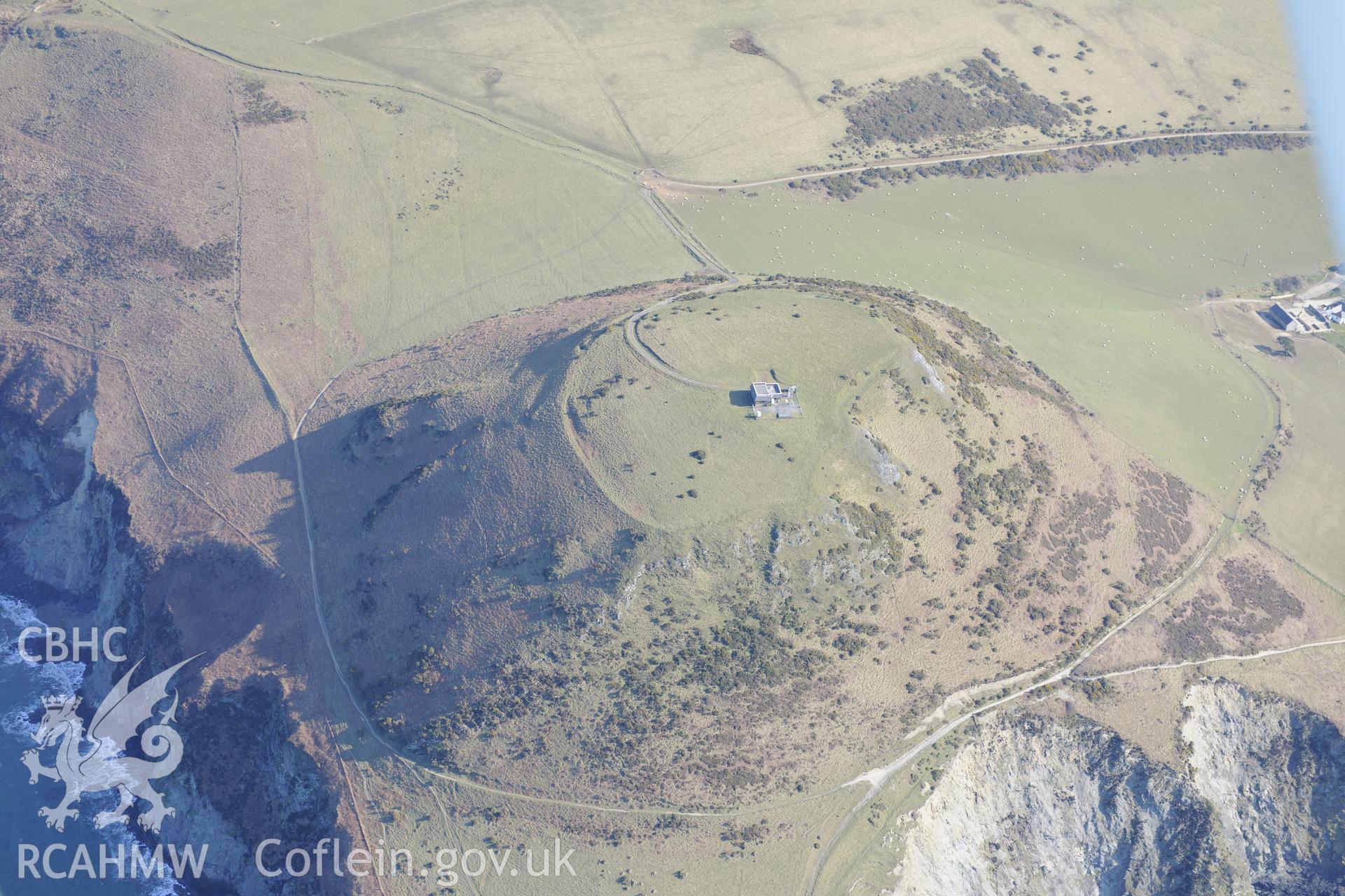 Pen Dinas Lochtyn hillfort, Llangrannog, north east of Cardigan. Oblique aerial photograph taken during the Royal Commission's programme of archaeological aerial reconnaissance by Toby Driver on 2nd April 2013.