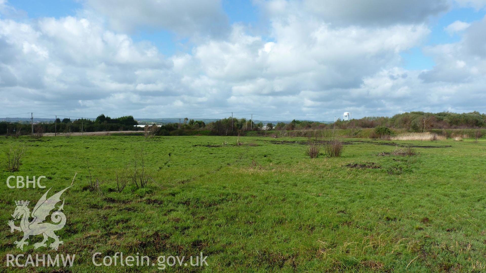 View northwest towards Carn Goch, with landscaped colliery waste on right hand side of photograph. Photographed during Setting Impact Assessment of Land off Phoenix Way, Garngoch Business Village, Swansea, carried out by Archaeology Wales, 2018. Project number P2631.