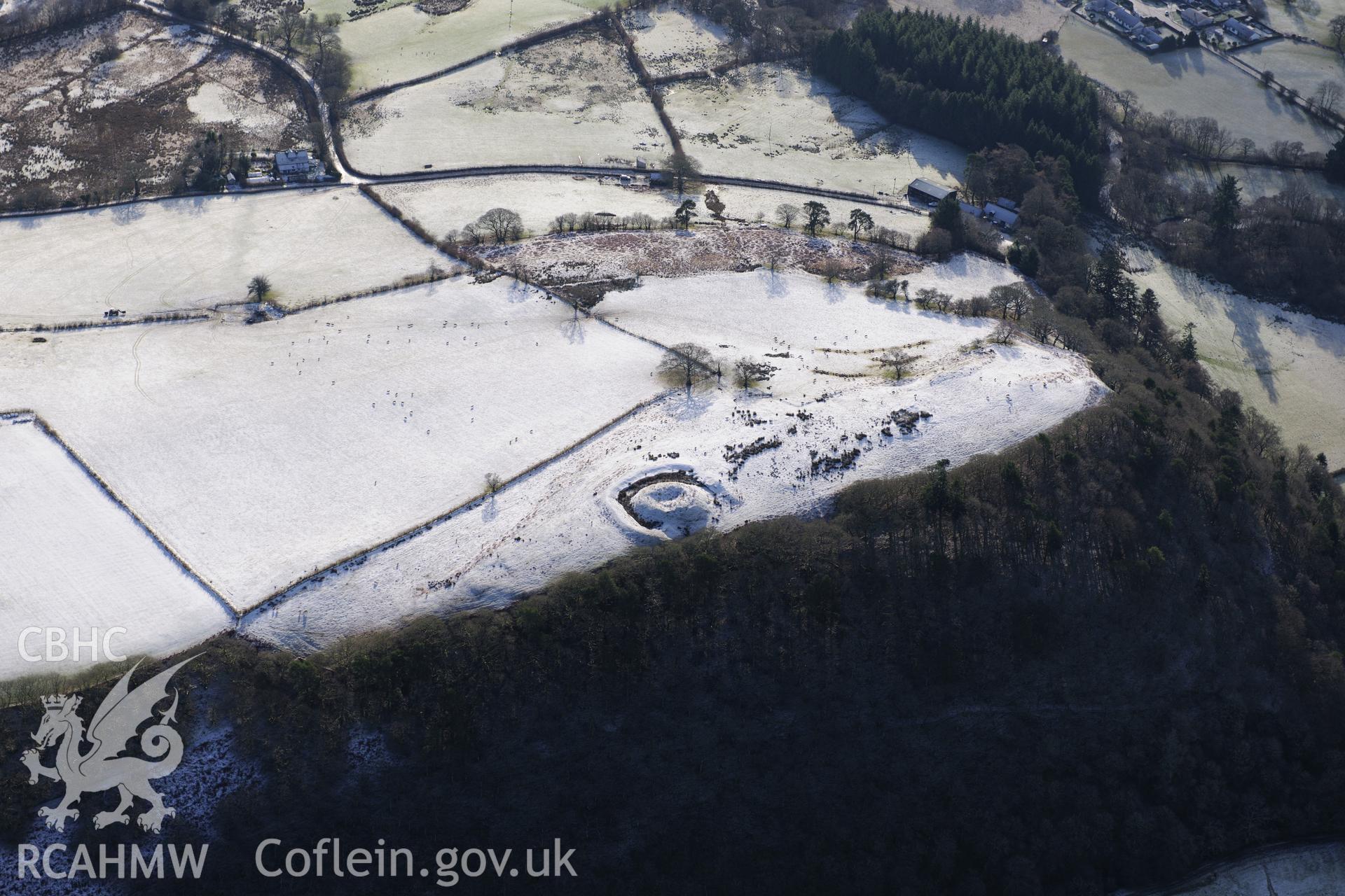 Fforest Castle and a house platform at Twdin Motte, north of Beulah, west of Builth Wells. Oblique aerial photograph taken during the Royal Commission?s programme of archaeological aerial reconnaissance by Toby Driver on 15th January 2013.