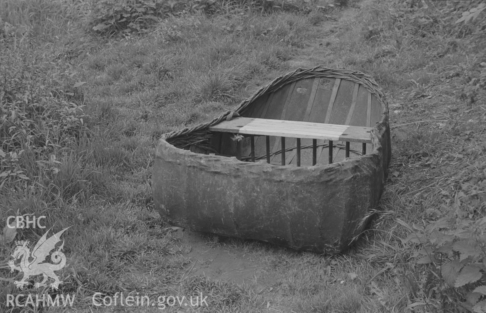 Digital copy of a black and white negative showing a coracle on path near the Teifi below the castle at Cilgerran. Photographed in September 1963 by Arthur O. Chater from Grid Reference SN 1950 4322.