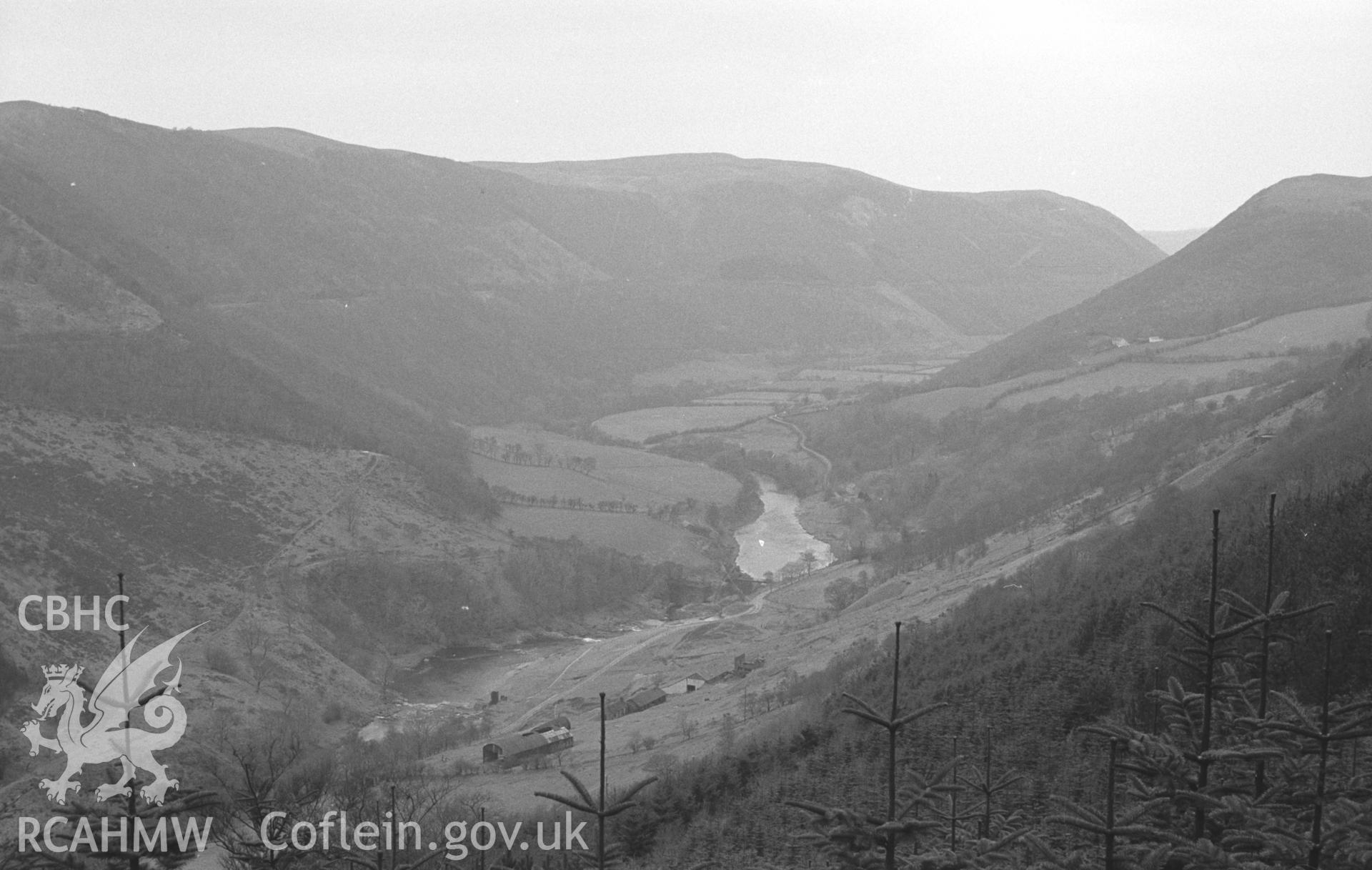 Digital copy of a black and white negative showing Cwm Rheidol lead mine and Devil's Bridge railway line from the old road up to Ystum Tuen. Photographed by Arthur O. Chater in April 1966 from Grid Reference SN 735 782, looking west.